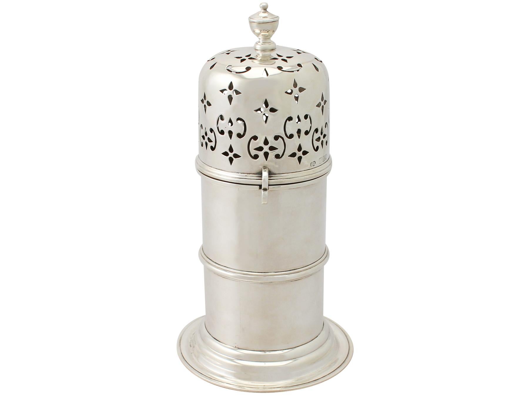 A very fine and impressive large antique Victorian English sterling silver lighthouse style caster; part of our silverware collection.

This impressive antique Victorian English sterling silver caster has a tapering cylindrical form onto a swept,