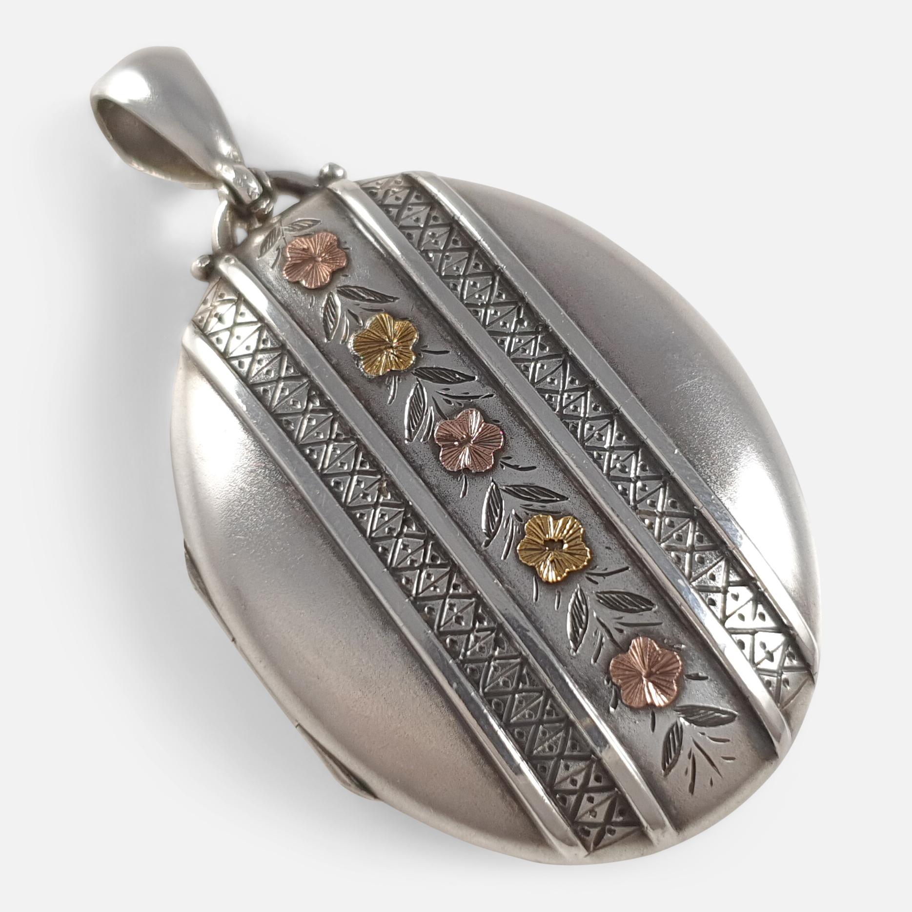 Description: - This is a fabulous antique Victorian sterling silver locket. The locket is engraved to the front with a column of flowers in two tone gold plating, and is plain polished to the back. The inside of the locket is lined with two pictures