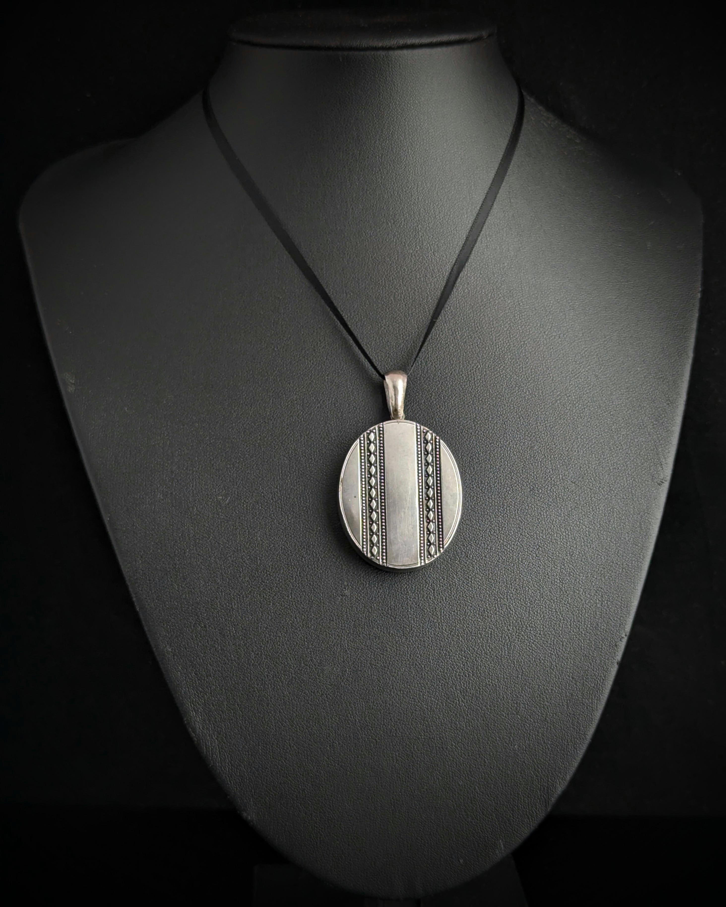 A beautiful Victorian silver locket like this is the perfect piece for adding the finishing touch to your favourite chain or necklace.

This aesthetic era piece is a good sized locket and has a good weight to it too, it has attractive engraving to