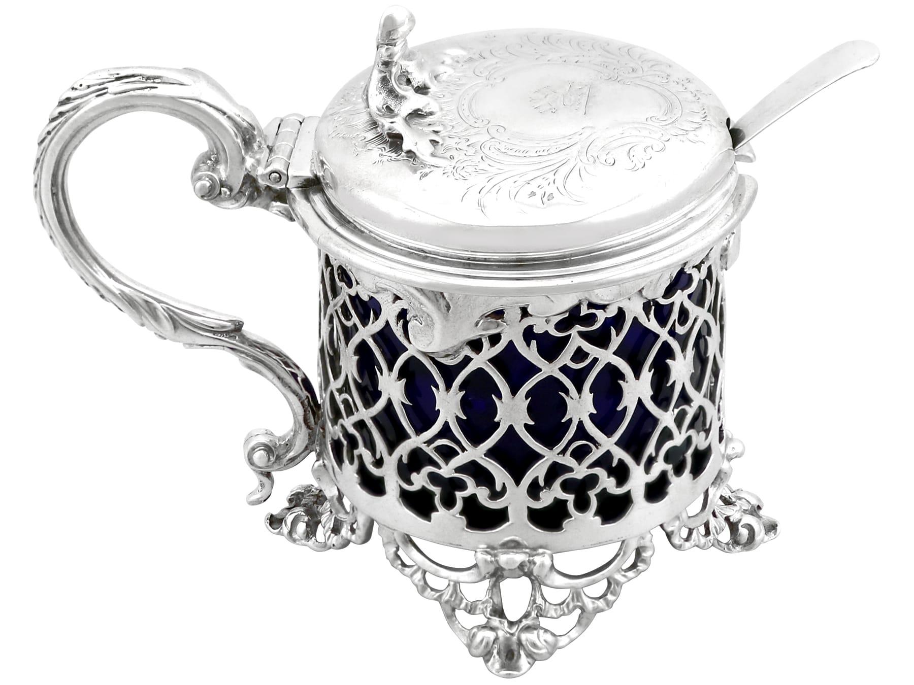 An exceptional, fine and impressive, large antique Victorian English sterling silver mustard pot; an addition to our 19th century silver cruets/condiments collection.

This exceptional and large antique Victorian sterling silver mustard pot has a