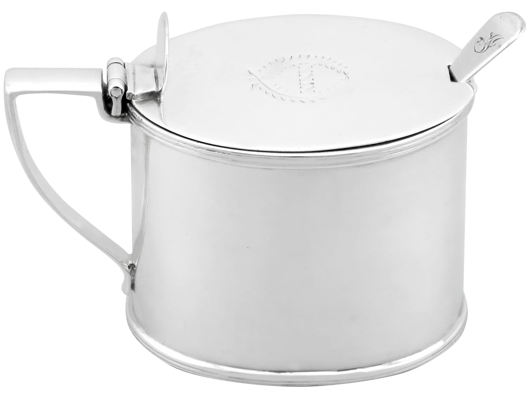 An exceptional, fine and impressive, large antique Victorian English sterling silver mustard pot; an addition to our silver cruets/condiments collection.

This exceptional and large antique Victorian sterling silver mustard pot has an oval