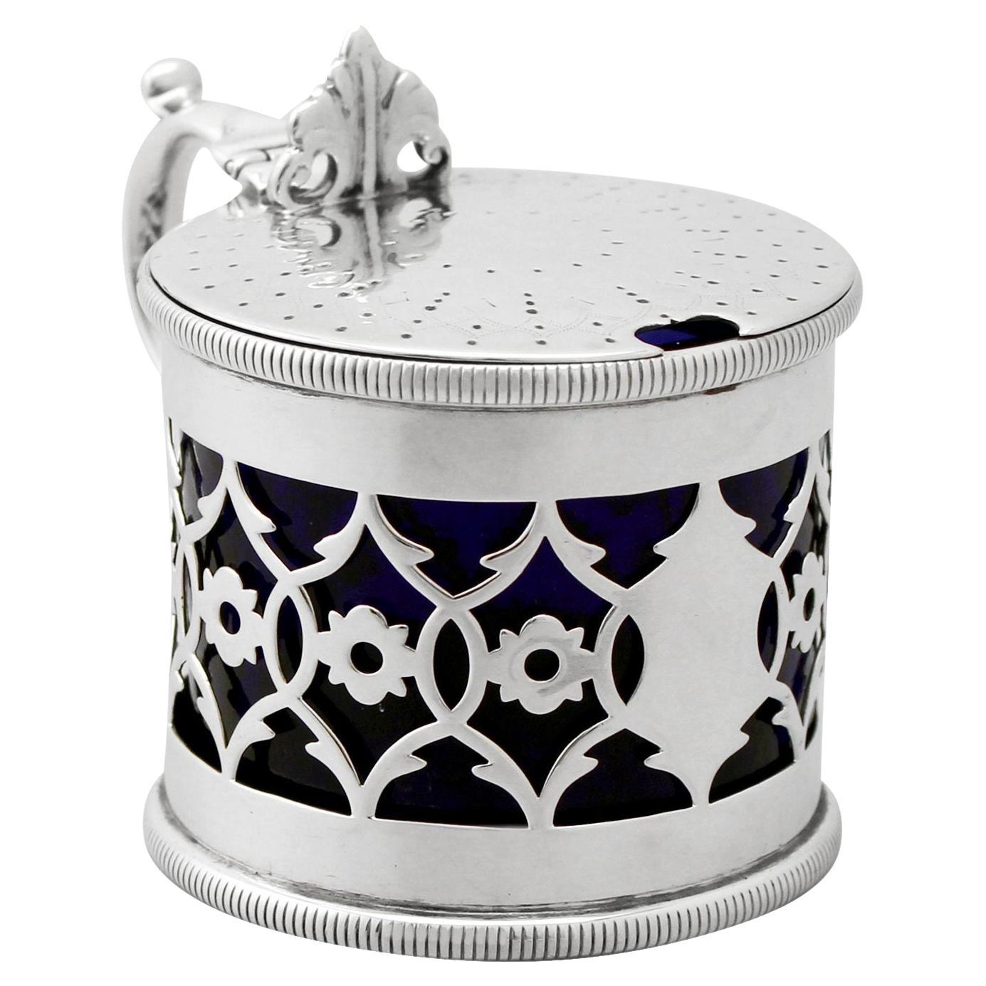 A fine and impressive antique Victorian English sterling silver mustard pot; an addition to our silver cruets/condiments collection.

This fine antique Victorian sterling silver mustard pot has a plain cylindrical form.

The body of the mustard