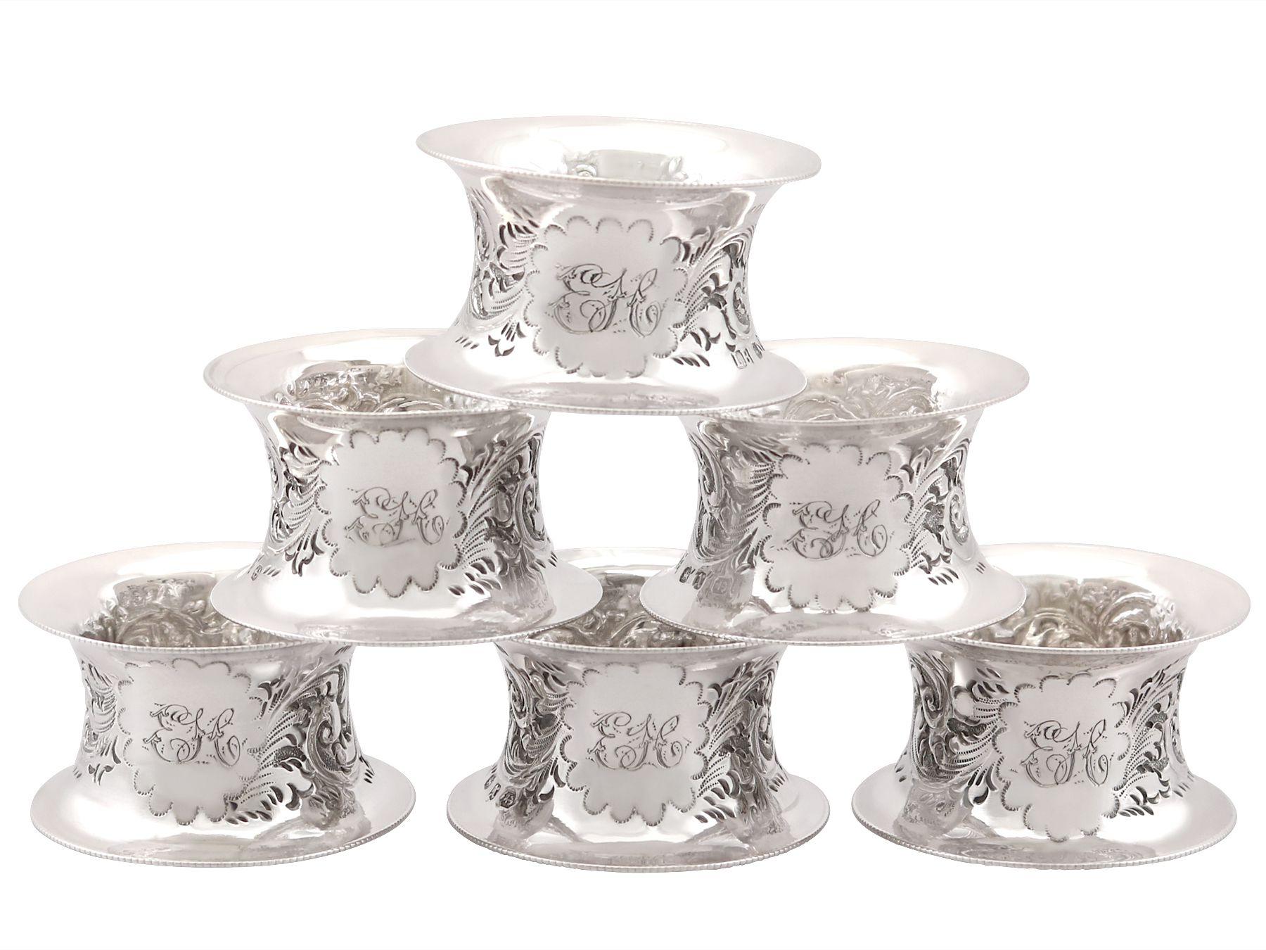An exceptional, fine and impressive set of six antique Victorian English sterling silver napkin rings - boxed; an addition to our dining silverware collection.

This exceptional set of antique Victorian silver napkin rings consists of six napkin