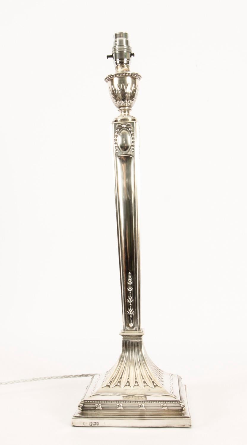 This is an impressive large antique late Victorian Neo-classical Adam Revival sterling silver table lamp bearing hallmarks for Sheffield 1900 and the makers mark of the renowned silversmiths The Goldsmiths and Silversmiths Company.
 
It features