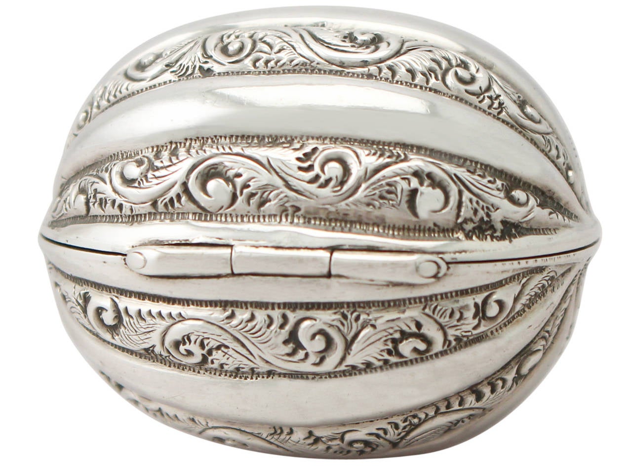 A fine and impressive antique Victorian English sterling silver nutmeg grater in the form of a natural nutmeg; an addition to our diverse silver box collection

This fine antique Victorian sterling silver nutmeg grater has been modelled in the