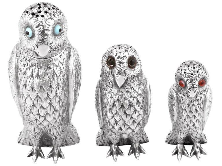 An exceptional, fine and impressive, rare set of antique English cast sterling silver pepperettes / peppers modelled in the form of owls; an addition to our collectable silver collection

These exceptional antique Victorian cast sterling silver