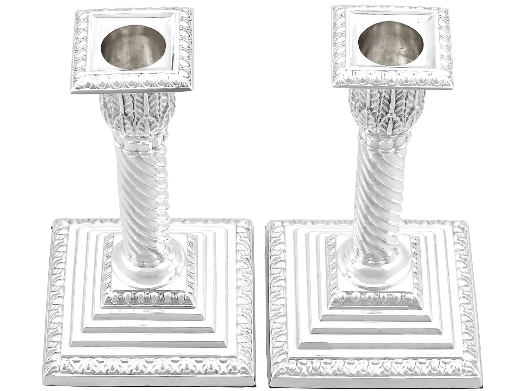 An exceptional, fine and impressive pair of antique Victorian English sterling silver piano candlesticks/candle holders; an addition of our ornamental silverware collection.

These exceptional antique Victorian sterling silver candlesticks have a