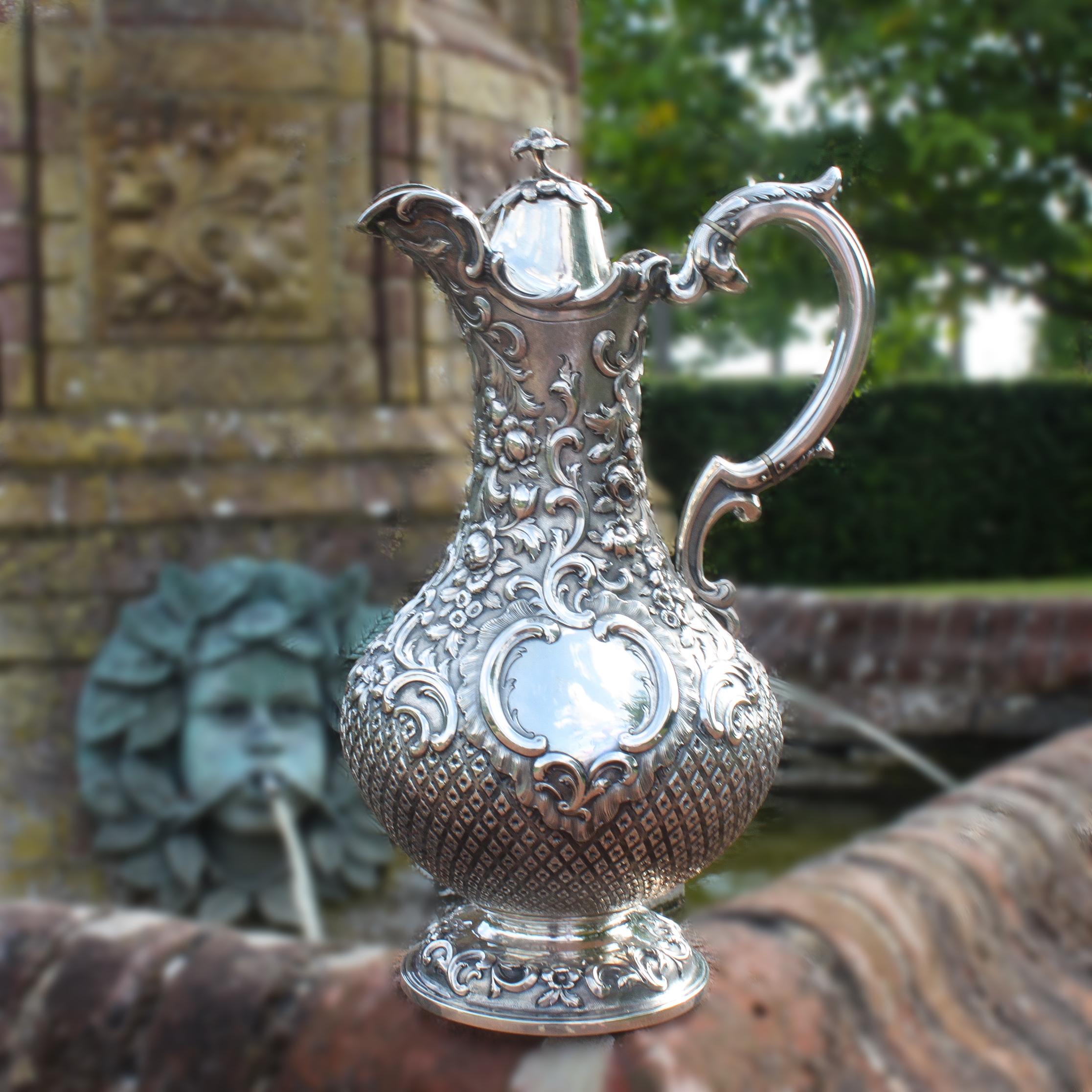 Antique Victorian sterling silver pitcher or ewer.
Made in Glasgow 1853
Maker: William Clarke Shaw
Fully hallmarked.

Dimensions:
Length 20 cm
Width 16 cm 
Height 31.5 cm
Weight: 1076 grams

Condition: General wear and tear, excellent