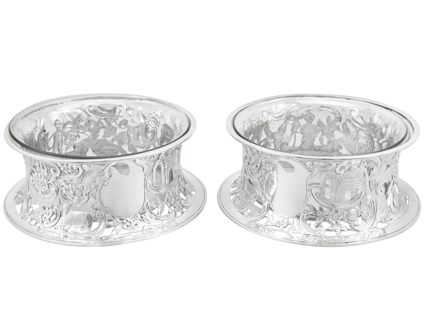 An exceptional, fine and impressive pair of antique Victorian English sterling silver potato dish rings; an addition to our ornamental silverware collection.

These exceptional antique Victorian sterling silver dish rings have a circular waisted