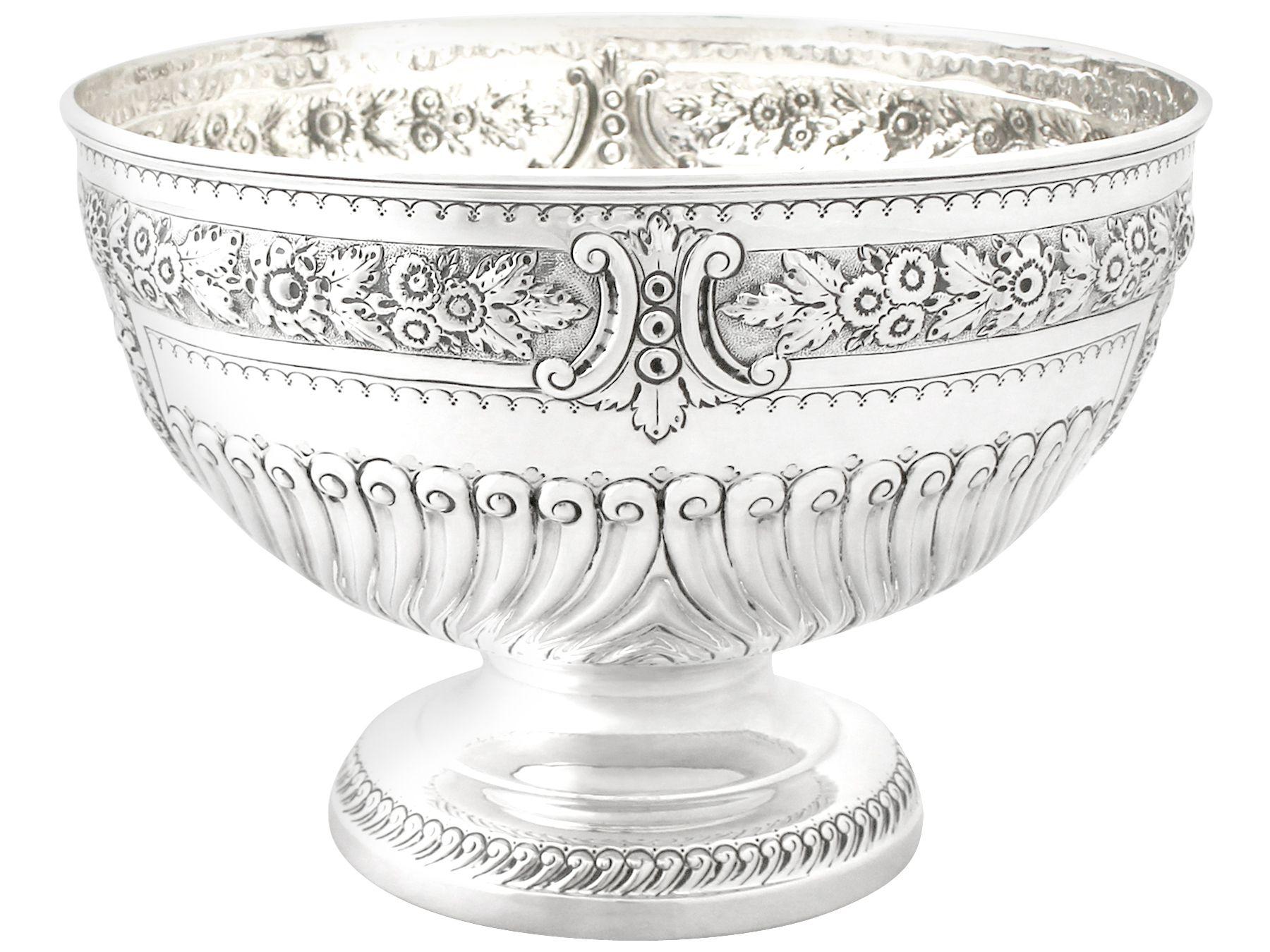 An exceptional, fine and impressive antique Victorian English sterling silver presentation bowl; an addition to our ornamental silverware collection

This exceptional antique sterling silver bowl has a circular form onto a circular domed