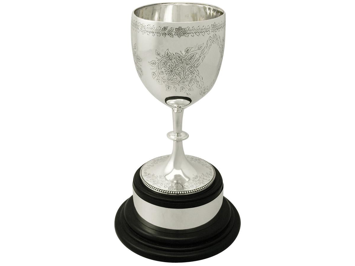 A fine and impressive antique Victorian English sterling silver presentation cup made by Charles Stuart Harris; part of our presentation silverware collection.

This fine antique Victorian sterling silver presentation cup has a plain circular bell