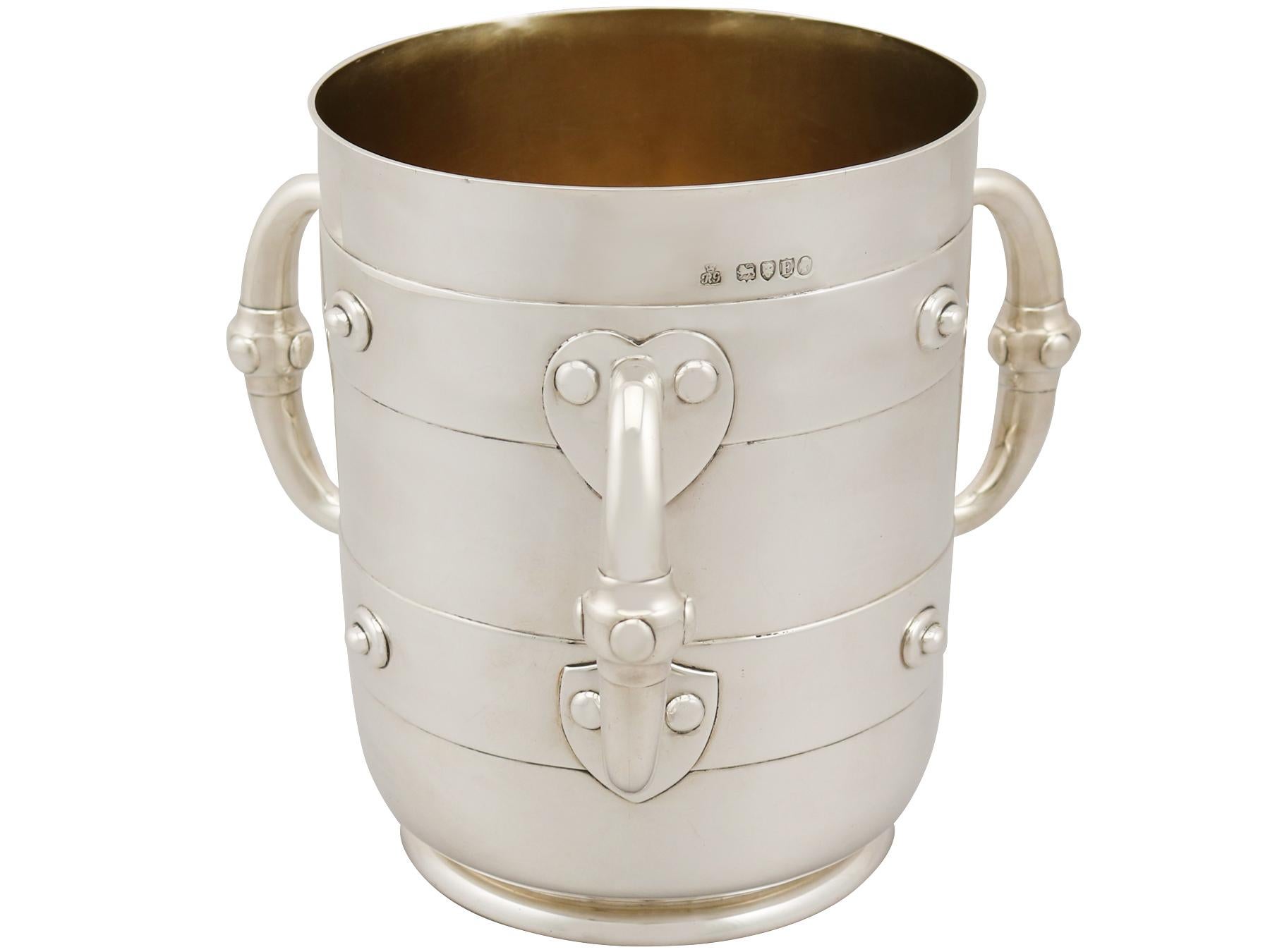 A fine and impressive antique Victorian English sterling silver presentation/champagne cup in the tyg and Arts & Crafts style; an addition to our ornamental silverware collection

This fine antique Victorian sterling silver tyg style