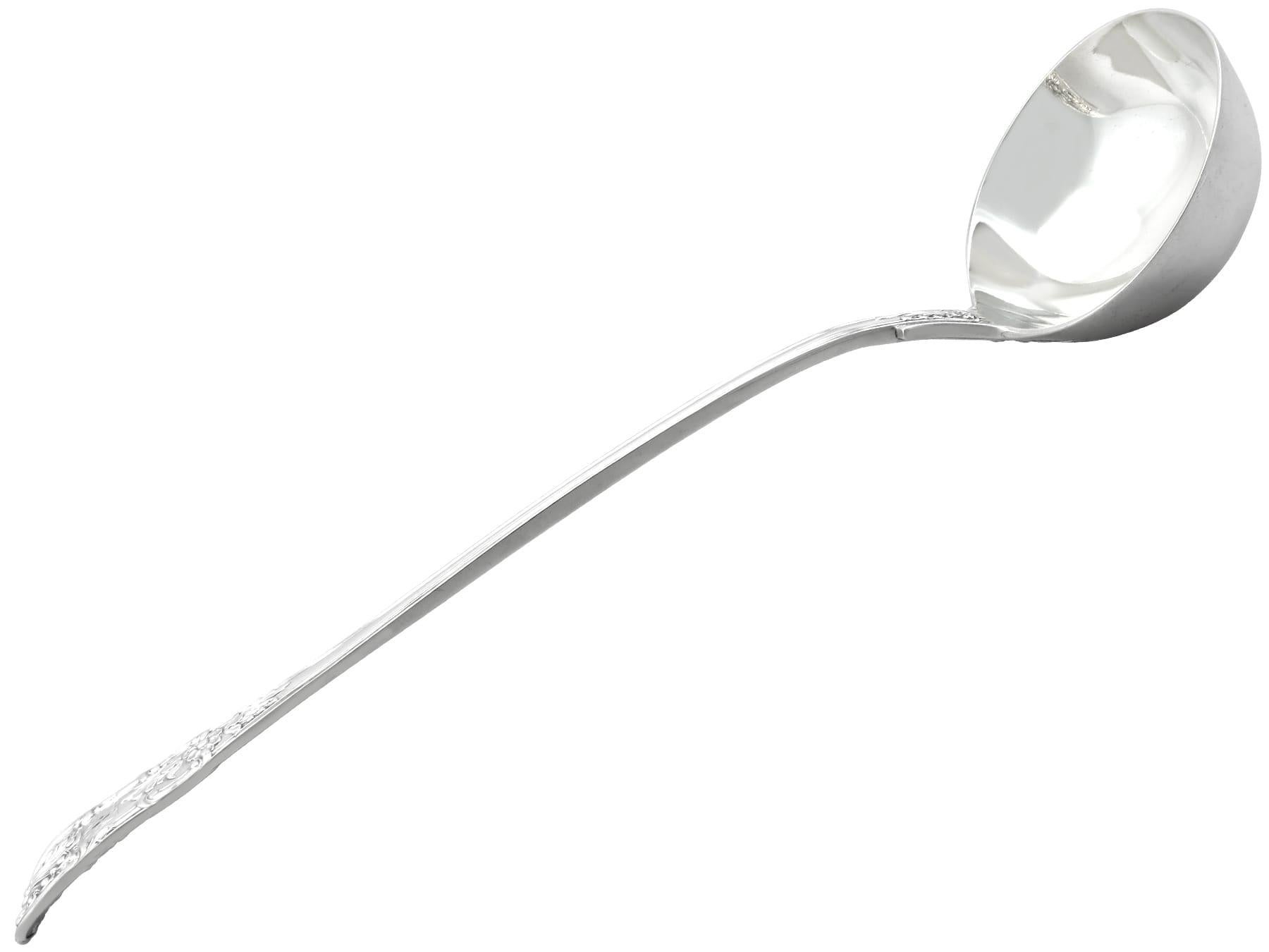 An exceptional, fine and impressive antique early Victorian English sterling silver Queen's pattern soup ladle; an addition to our Victorian flatware collection.

This exceptional antique Victorian sterling silver ladle has been crafted in the