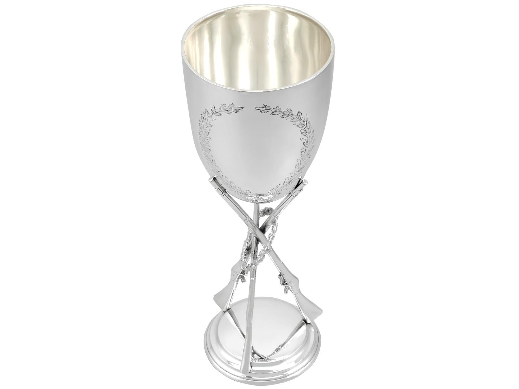 An exceptional, fine and impressive antique Victorian English sterling silver presentation cup with shooting/rifle interest; an addition to our diverse presentation silverware collection.

This exceptional, fine and impressive antique Victorian