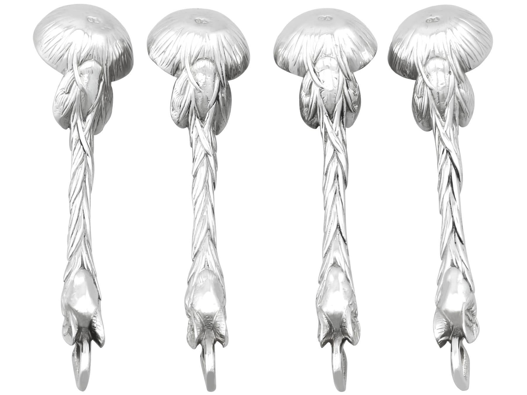 An exceptional, fine and impressive set of four antique Victorian English sterling silver salt spoons; an addition to our silver flatware collections.

These exceptional antique Victorian English sterling silver spoons have been crafted in a