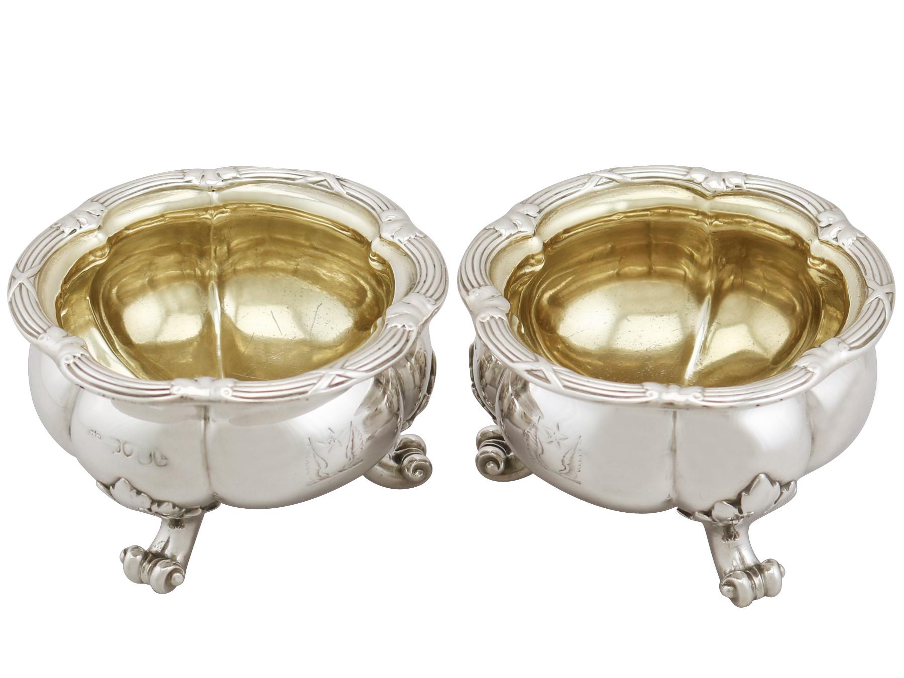 An exceptional, fine and impressive pair of antique Victorian English sterling silver salts made by Paul Storr; an addition to our silver cruet and condiment collection.

These exceptional antique Victorian sterling silver salts have a circular