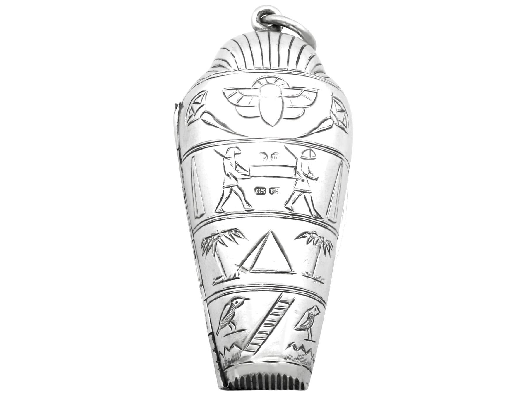 An exceptional, fine and impressive, unusual antique Victorian English sterling silver sarcophagus vesta case; an addition to our silver case collection.

This fine antique Victorian English sterling silver vesta case has been realistically modelled