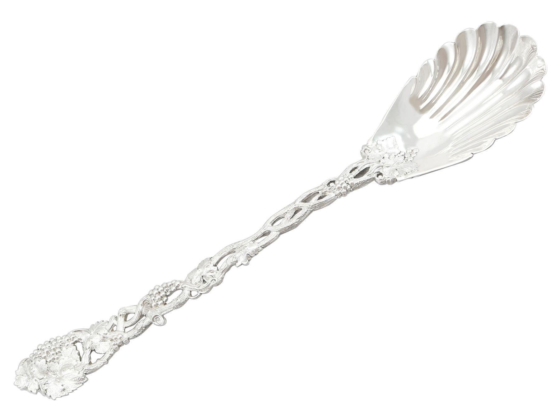 A magnificent, fine and impressive, pair of antique Victorian sterling silver Pierced Vine pattern serving spoons; an addition to our silver flatware collection.

These magnificent antique silver spoons, in sterling standard have been crafted in