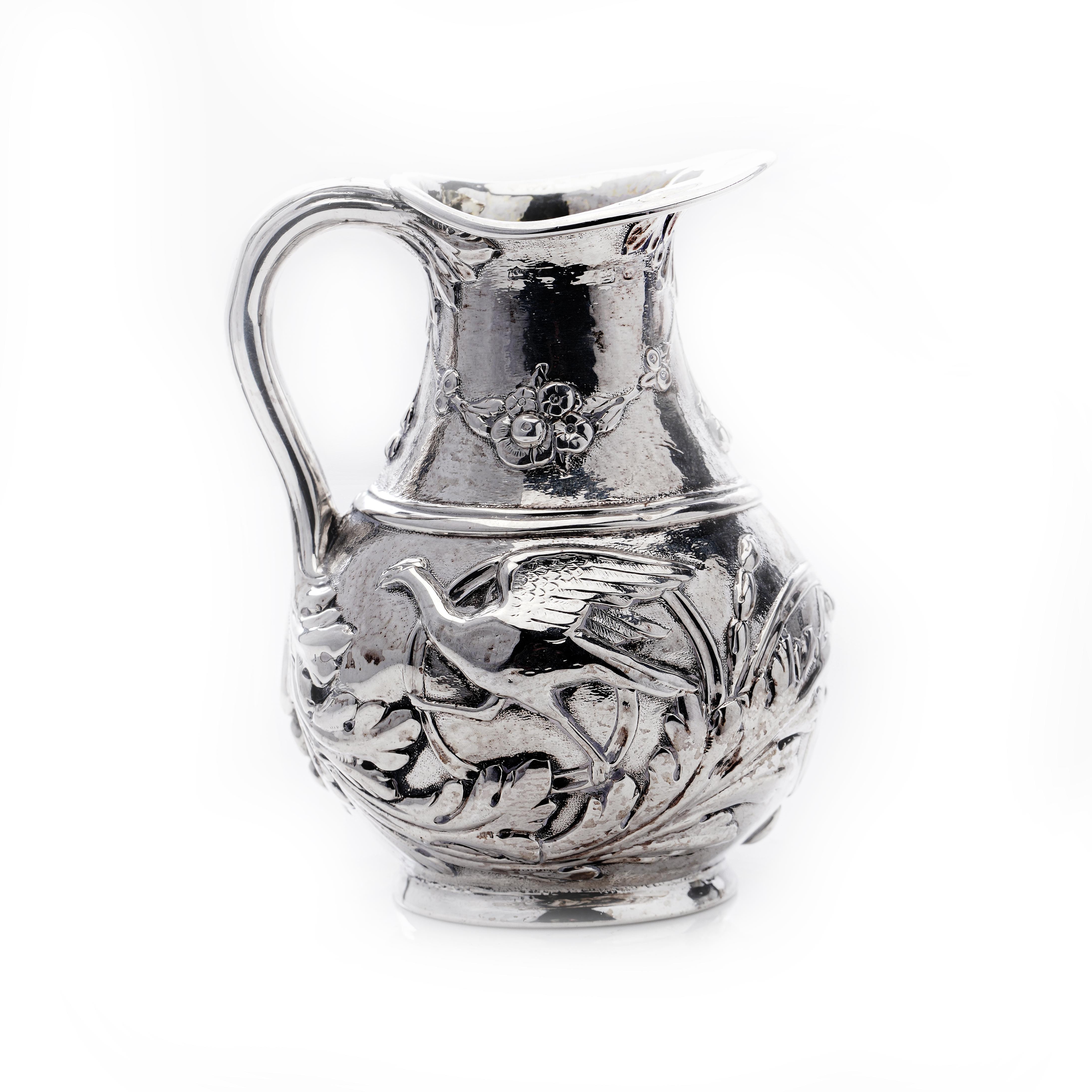 Antique Victorian sterling silver small cream jug with scenes. 
Made in England, Ca.1870's 
Maker: Maker's mark is partially faded. 

Approx. Dimensions - 
Diameter x height: 6.5 x 8.5 cm 
Weight: 83 grams in total. 

Condition: Jug is in
