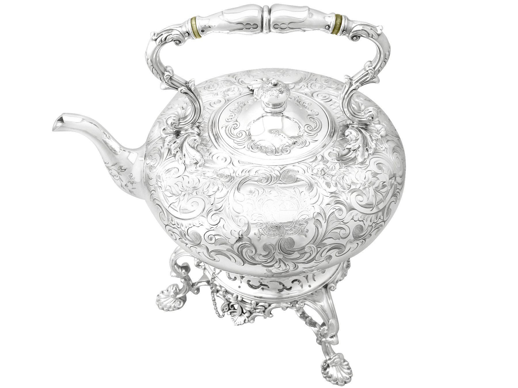 An exceptional, fine and impressive, antique Victorian English sterling silver spirit kettle; an addition to our antique silver Teaware collection.

This exceptional antique Victorian sterling silver spirit kettle has a bulbous shaped form.

The