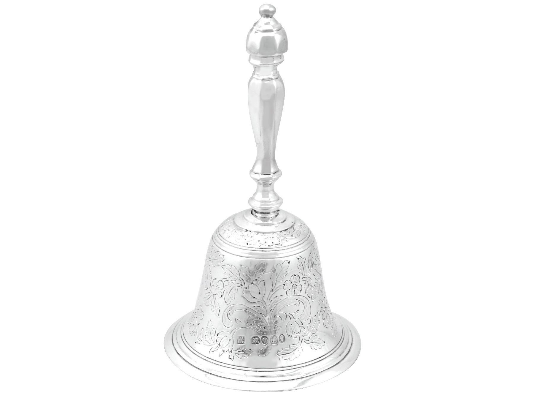 An exceptional, fine and impressive antique Victorian English sterling silver table bell; an addition to our range of ornamental silverware. 

This exceptional antique Victorian sterling silver hand bell has a plain bell-shaped form.

The