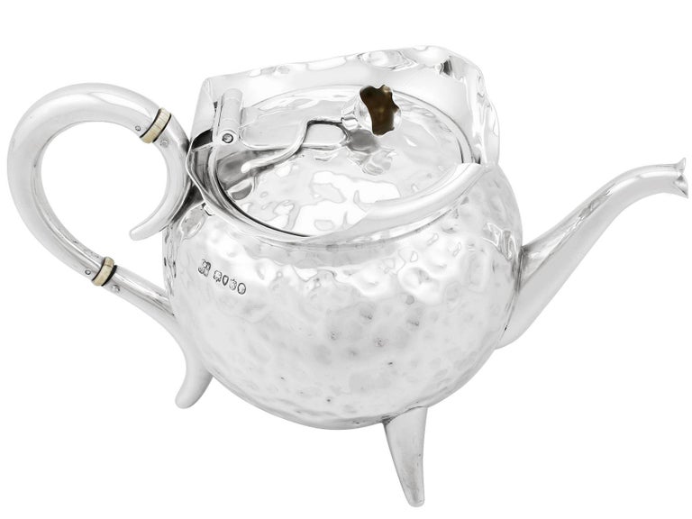 An exceptional, fine and impressive, unusual antique Victorian English sterling silver teapot; an addition to our silver teaware collection.

This exceptional antique Victorian teapot, in sterling standard silver, has a circular shaped