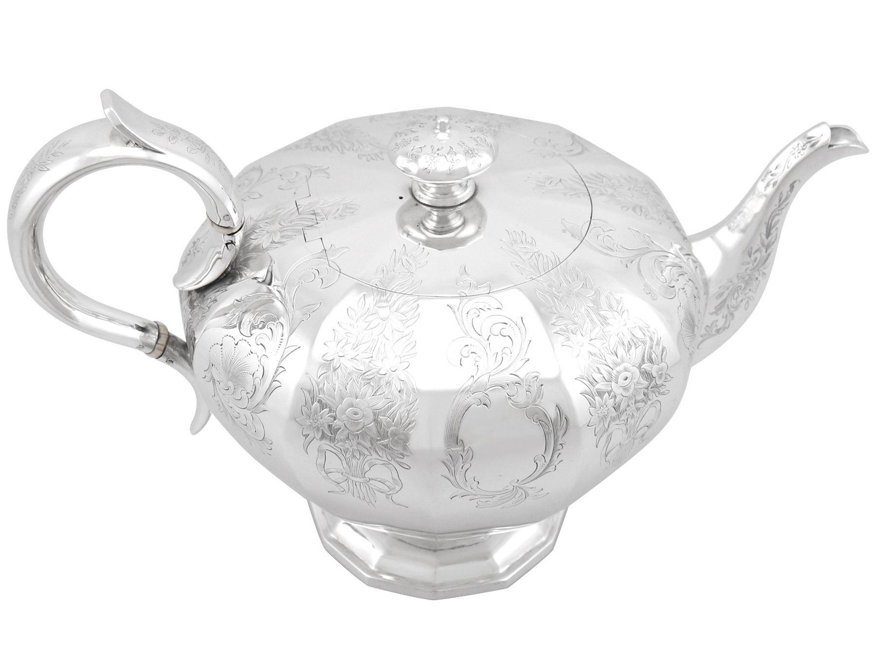 An exceptional, fine and impressive, large antique Victorian English sterling silver teapot made by Charles Riley & George Storer; an addition to our silver teaware collection.

This impressive antique Victorian sterling silver teapot has a