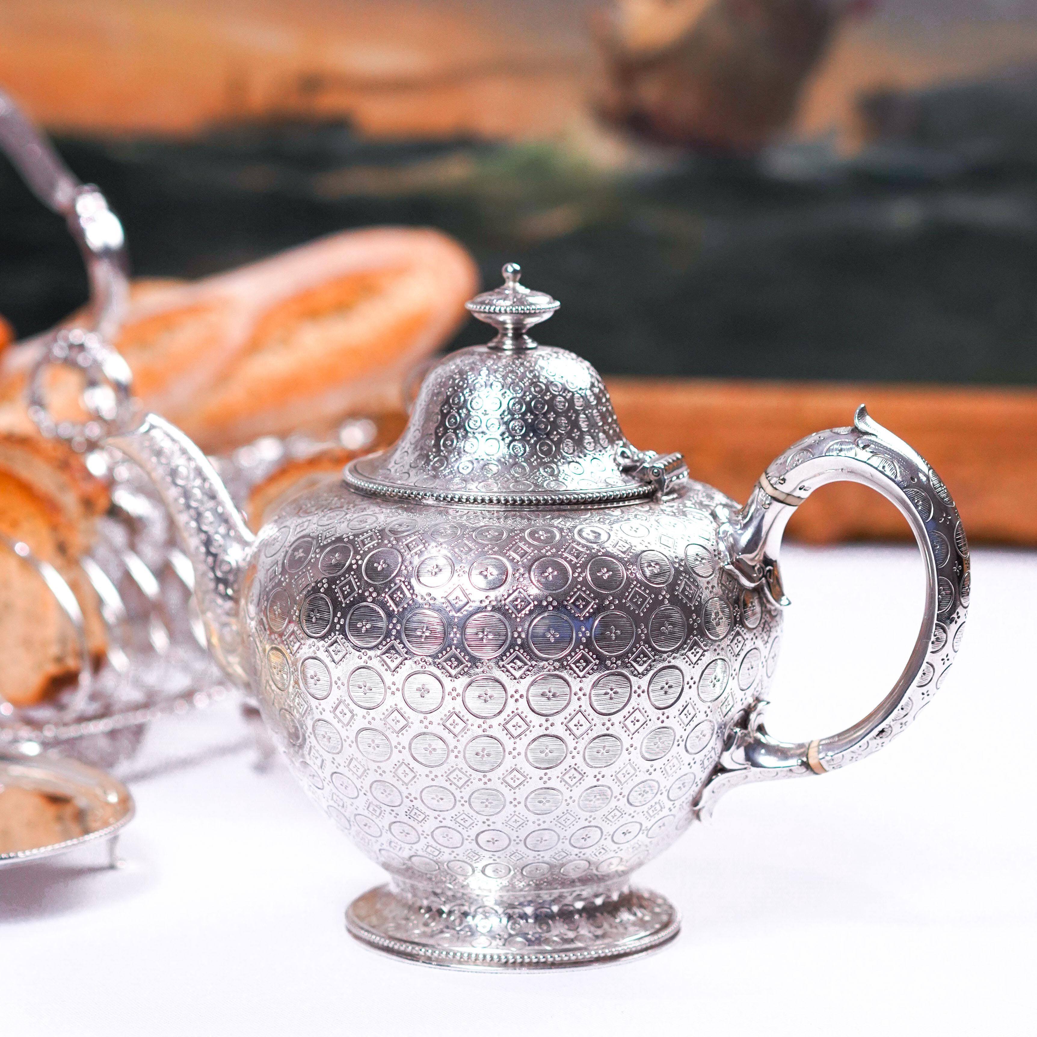 We are delighted to offer this unique and exquisite Victorian solid silver teapot made by the renowned silversmiths, Barnards of London in 1863.
  
The teapot features a classical bulbous overall design with generous proportions allowing for