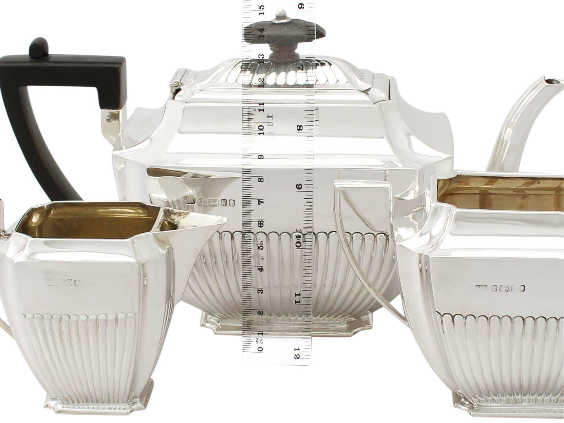 A fine and impressive antique Victorian English sterling silver three piece tea service - boxed; an addition to our silver teaware collection.
This antique Victorian sterling silver three piece tea set / service consists of a teapot, sugar bowl and