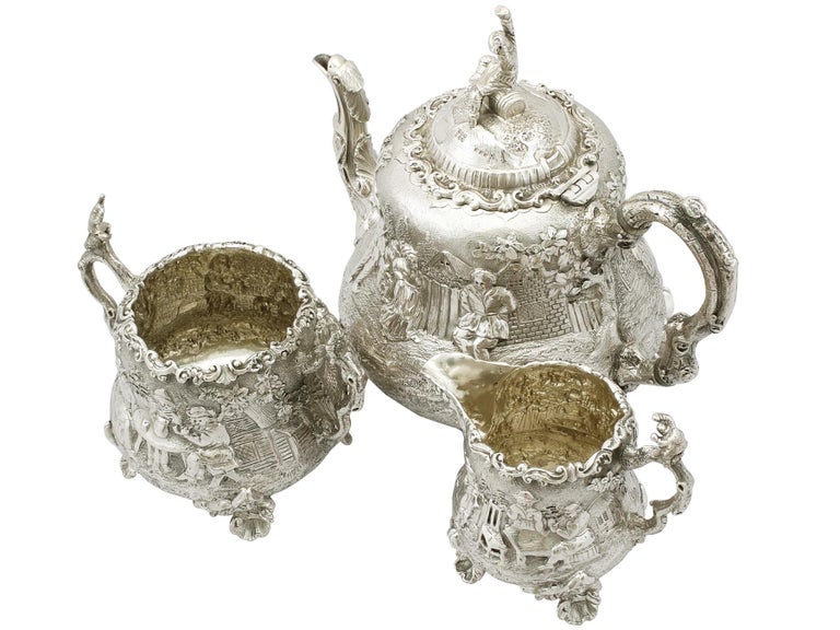 An exceptional, fine and impressive antique Victorian English sterling silver three-piece tea service / tea set made by Frederick Elkington of Elkington & Co., part of our silver teaware collection.

This exceptional antique Victorian sterling