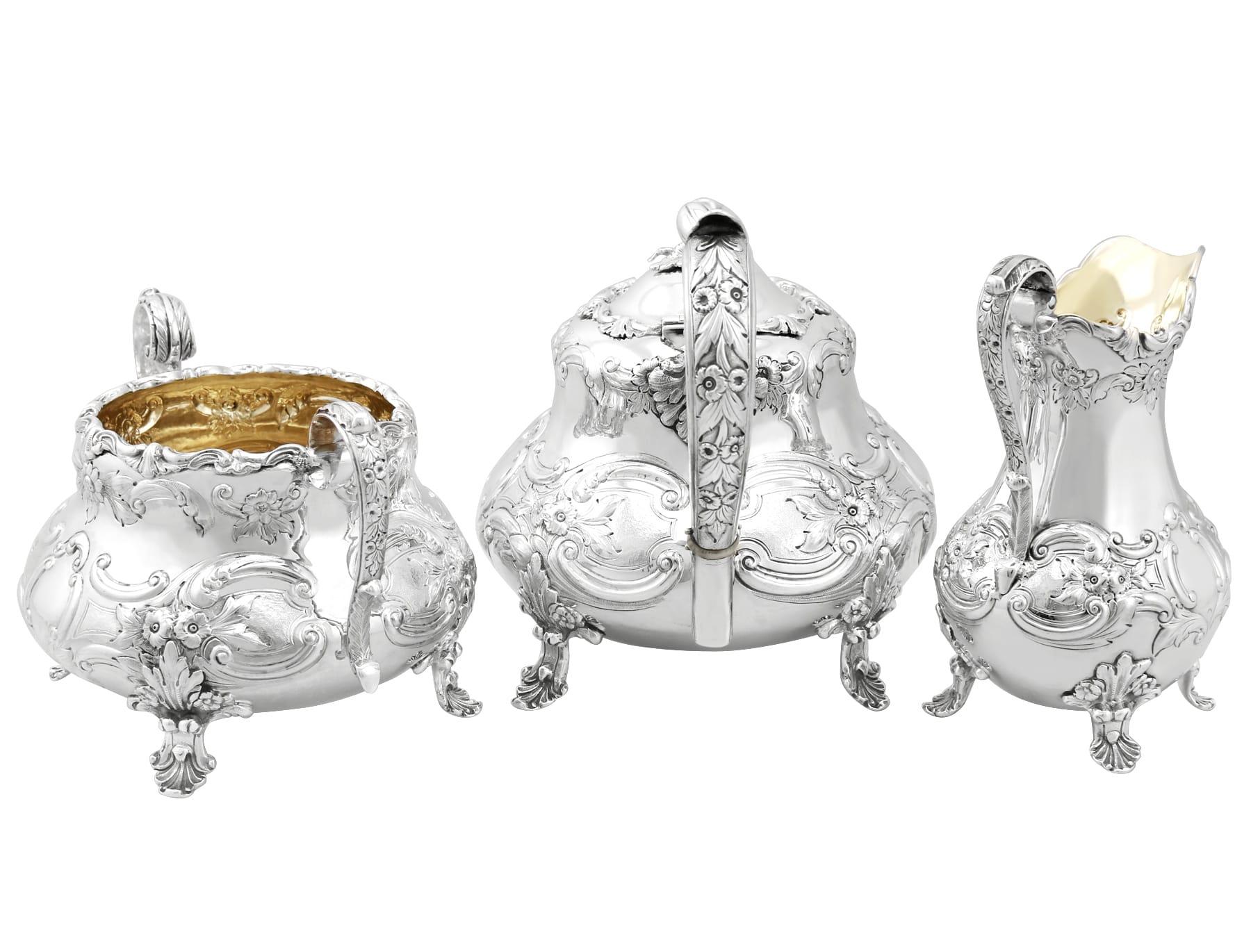 An exceptional, fine and impressive, antique Victorian English sterling silver three-piece tea service; part of our silver teaware collection.

This magnificent antique Victorian sterling silver three-piece tea set consists of a teapot, sugar bowl