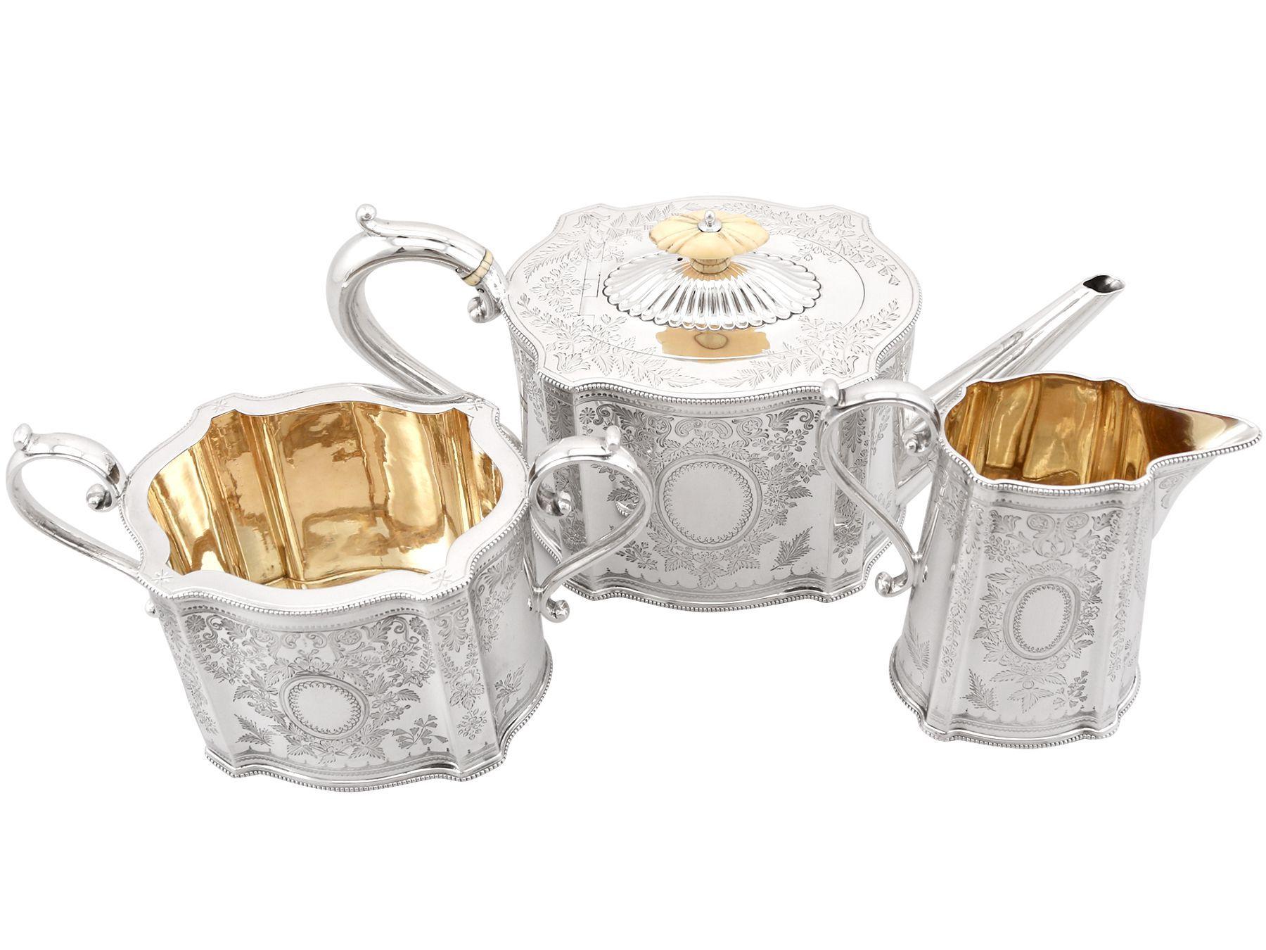 An exceptional, fine and impressive antique Victorian English sterling silver three piece tea service; an addition to our silver teaware collection.

This exceptional antique Victorian three piece silver tea set consists of a teapot, sugar bowl and