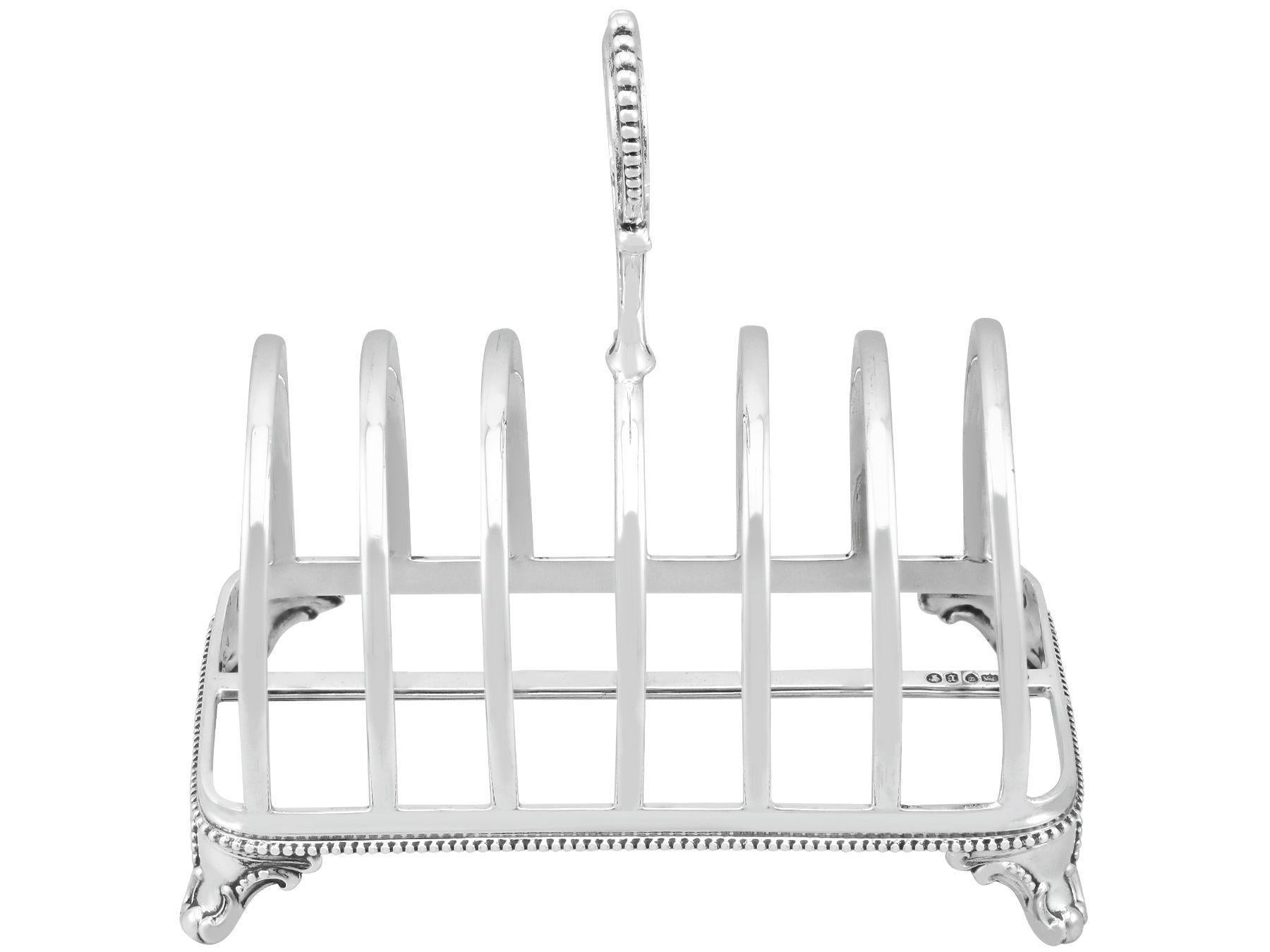 An exceptional, fine and impressive antique Victorian English sterling silver toast/letter rack; an addition to our dining silverware collection

This exceptional antique Victorian silver toast rack, in sterling standard, has a plain rounded