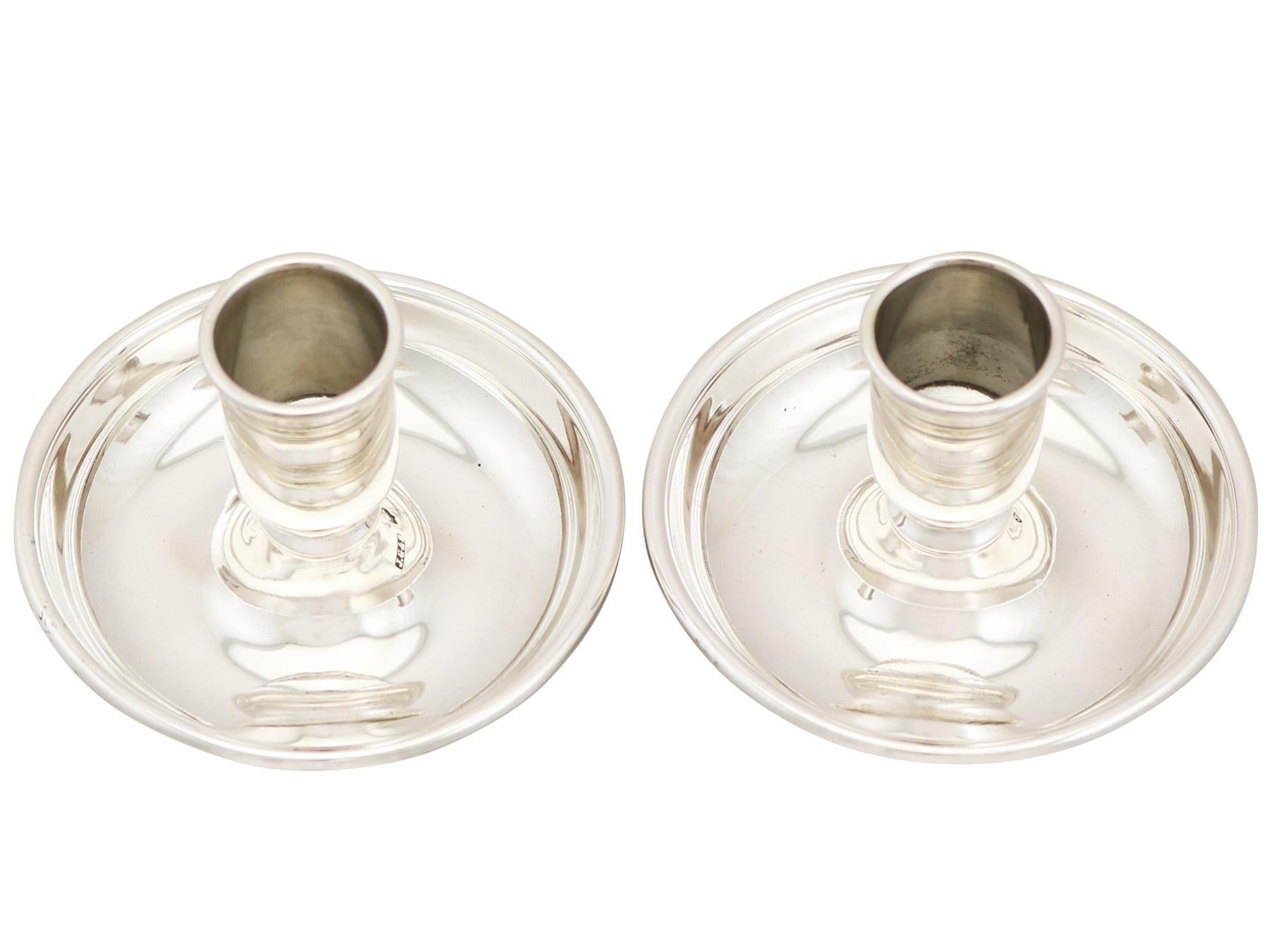 An exceptional, fine and impressive pair of antique Victorian English sterling silver travelling candlesticks; an addition to our ornamental silverware collection.

These exceptional antique Victorian sterling silver travelling candlesticks have a