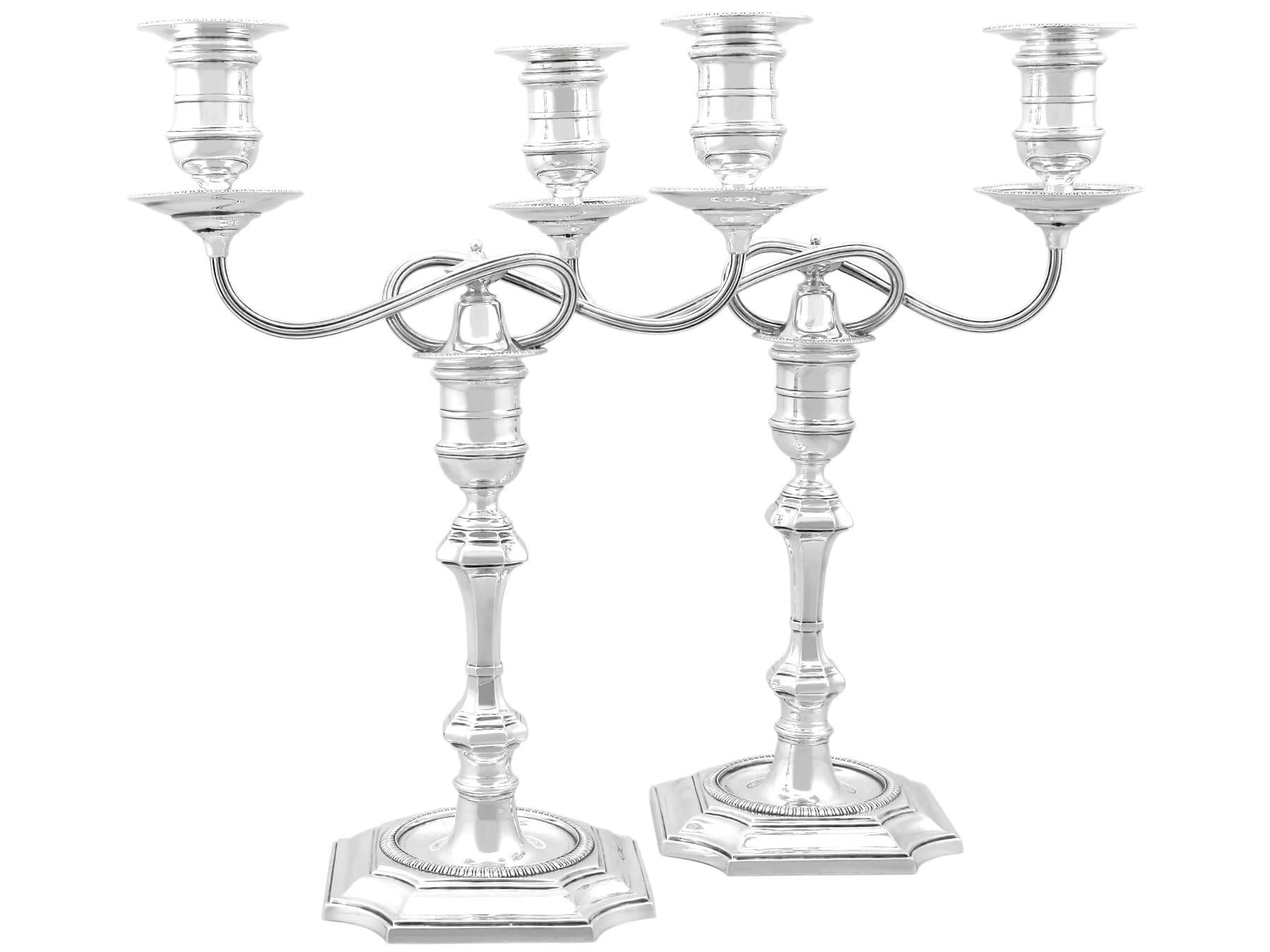 An exceptional, fine and impressive pair of antique Victorian English sterling silver two-light candelabra; an addition to our Victorian silverware collection.

These exceptional antique Victorian sterling silver candelabra have a classical