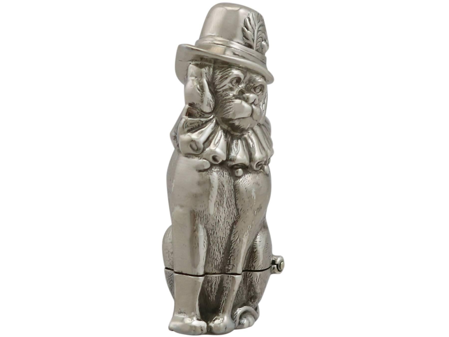 An exceptional, fine and impressive antique Victorian English sterling silver vesta case in the form of a Punch's dog; an addition to our diverse smoking related silverware collection.

This fine antique Victorian sterling silver vesta case is