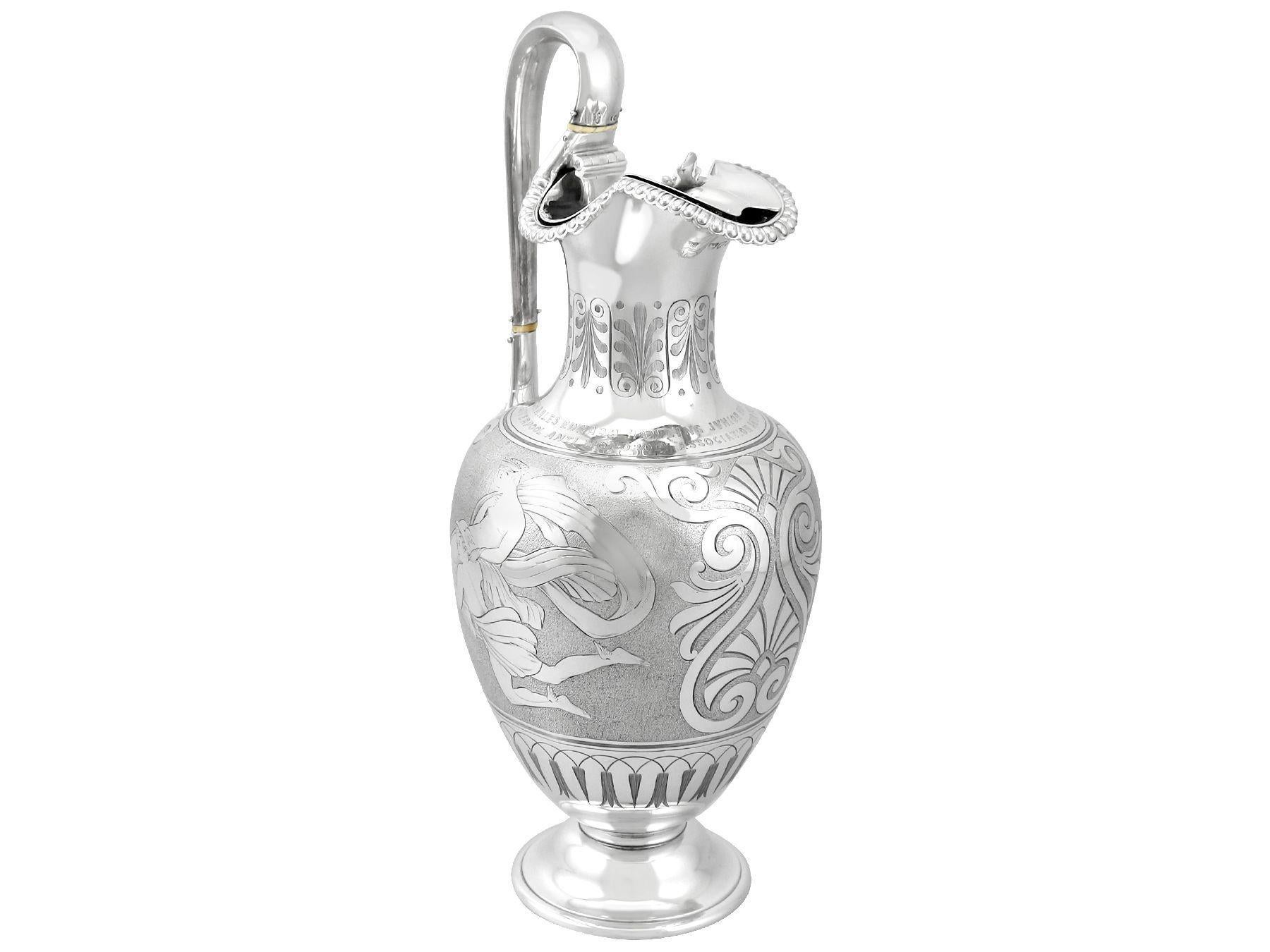 An exceptional, fine and impressive, antique Victorian sterling silver water pitcher/jug; part of our antique dining silverware collection.

This exceptional sterling silver water jug has a baluster shaped form onto a circular spreading
