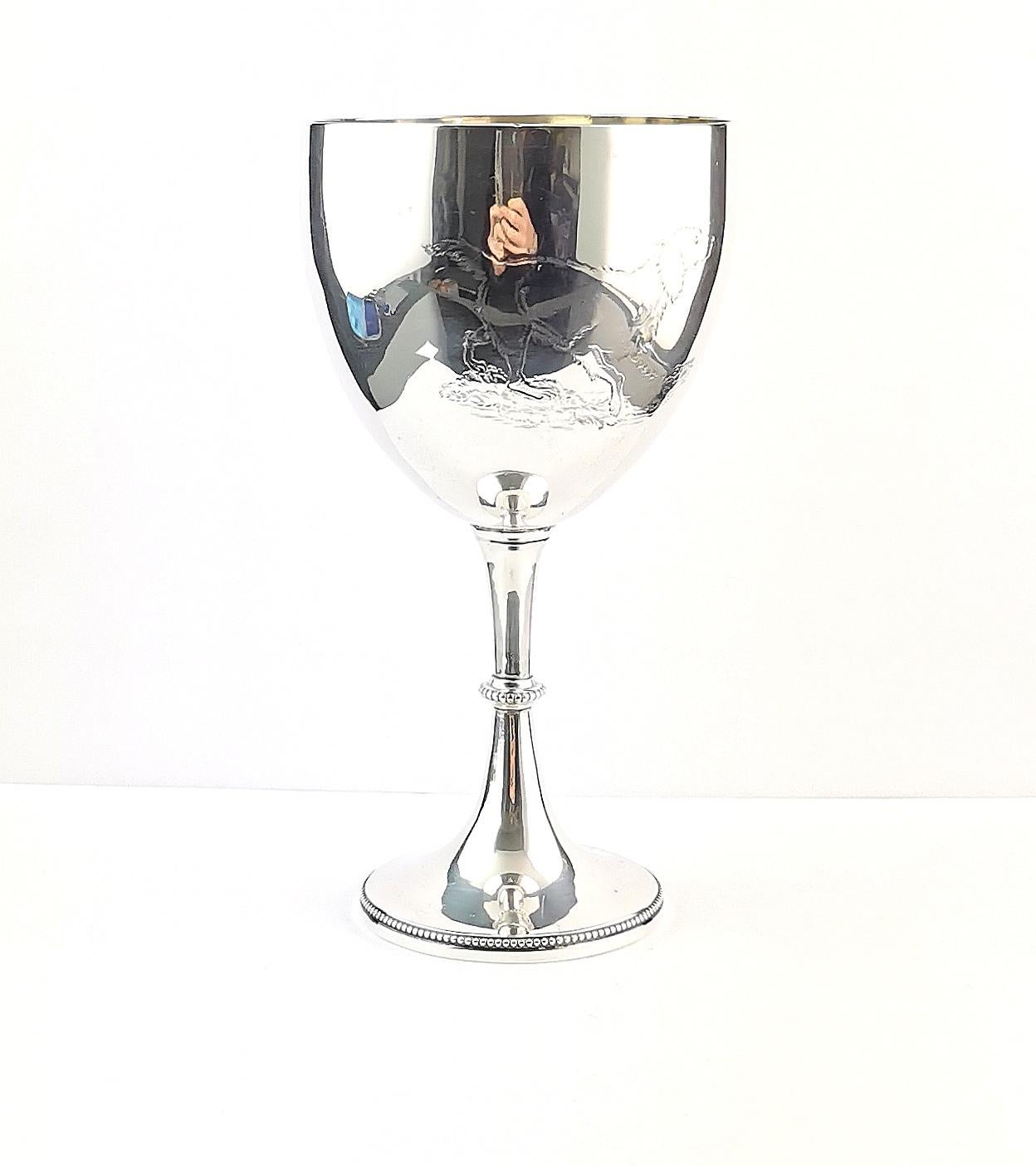 This antique Victorian sterling silver wine goblet is simply charming.

It has a wonderful engraving of a stalking dog to the front, very detailed it appears to be a retriever type dog.

It has a blank circular cartouche to the opposite side so