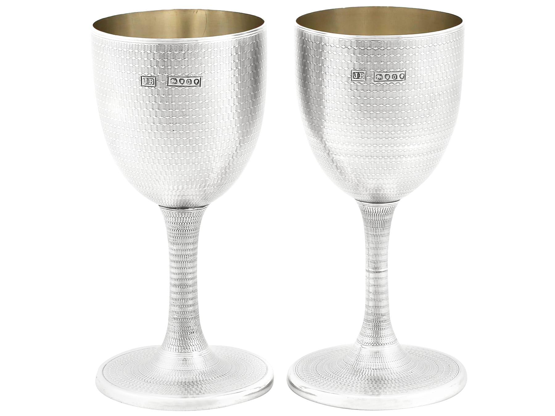 An exceptional, fine and impressive pair of antique Victorian English sterling silver wine goblets; an addition to our range of wine and drink related silverware.

These exceptional antique Victorian sterling silver wine goblets have a plain