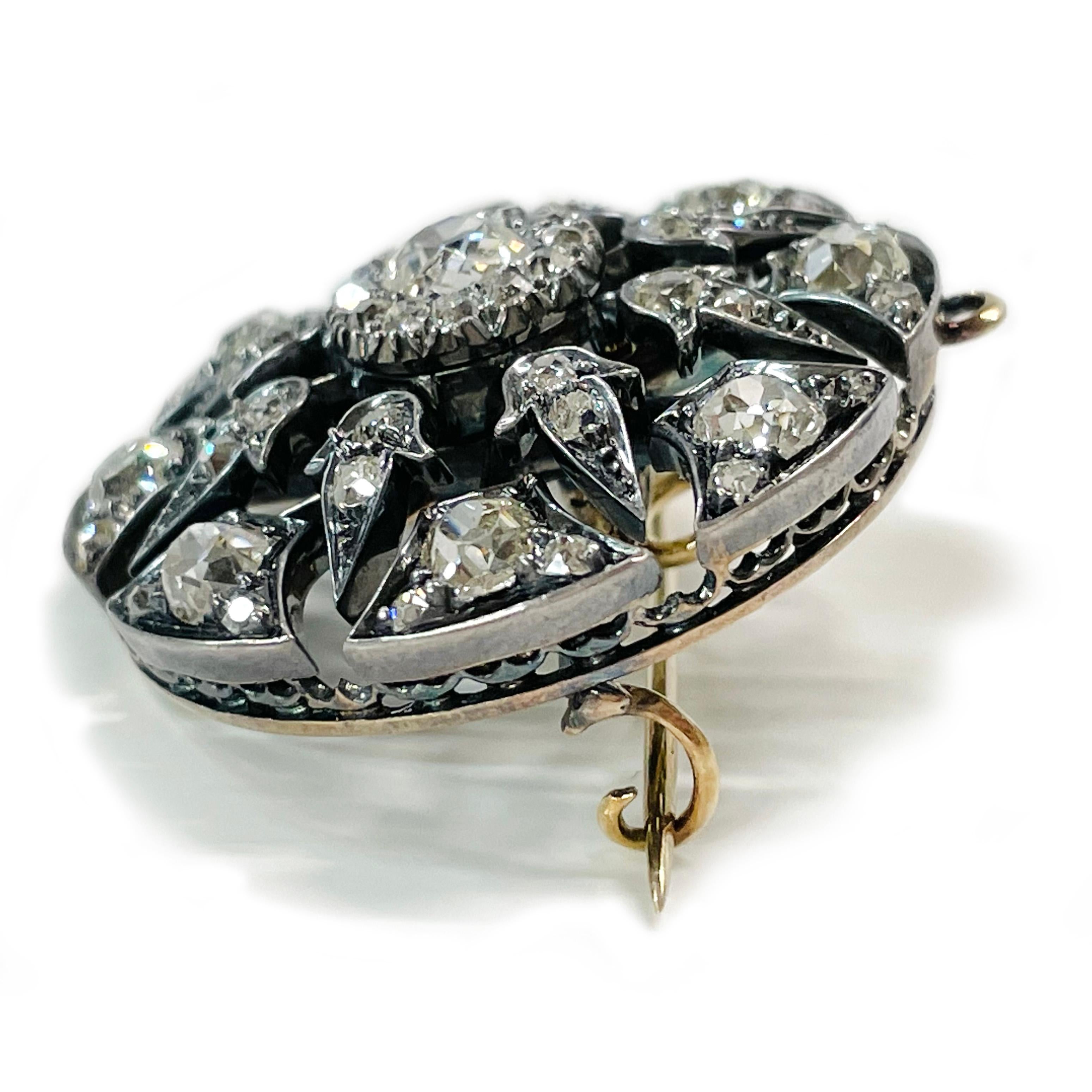 Antique Victorian (circa 1850s) Sterling Silver 14 Karat Yellow Gold Euro-Cut Diamond Pendant Brooch. This is an absolutely gorgeous mourning pendant brooch with a total of fifty-three Euro-cut diamonds. There is one 5.1mm, eight 2.2mm, eight 3.8mm,