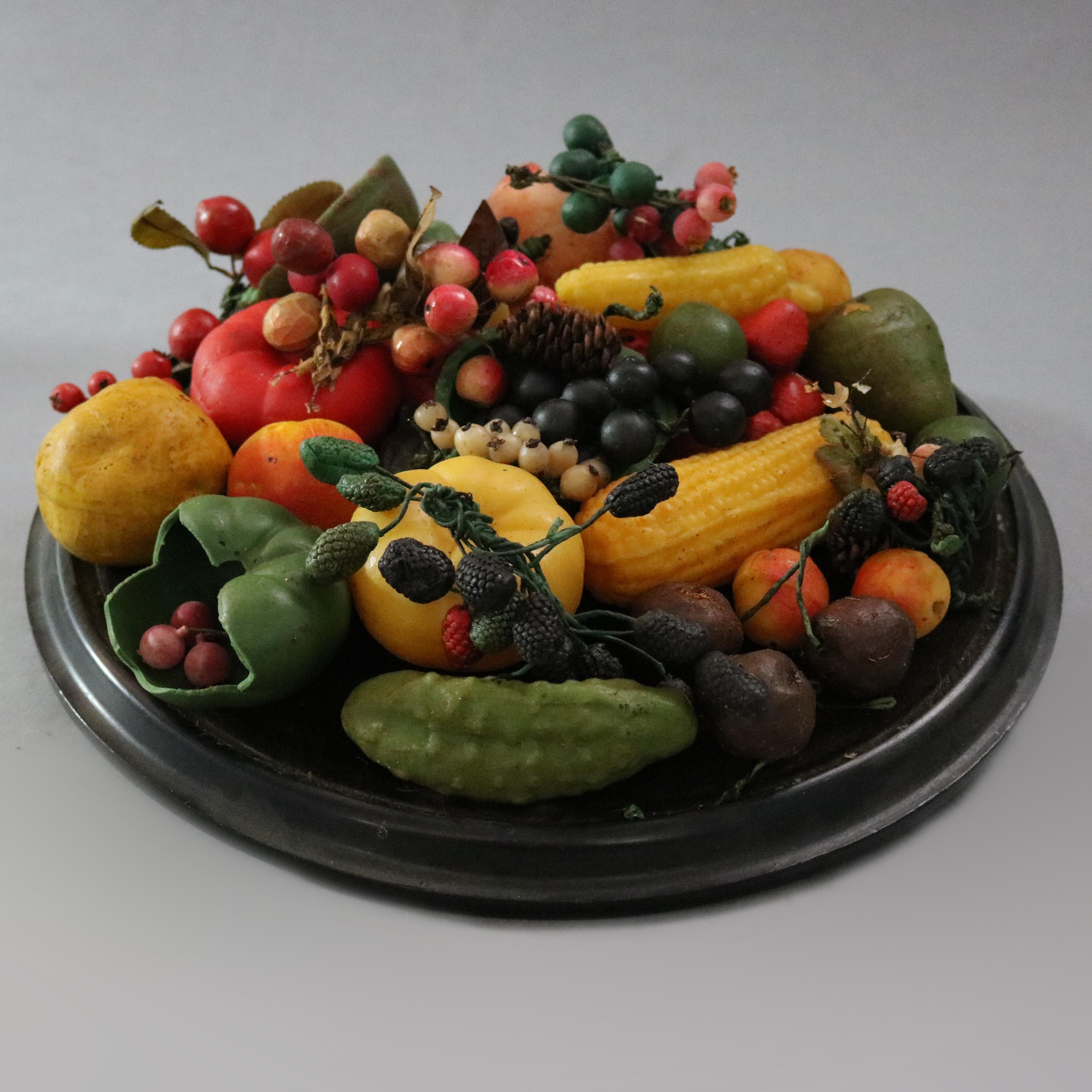 An antique Victorian still life arrangement offers a variety of loose wax fruits displayed on wood base under glass dome, circa 1880

Measures: 8.75