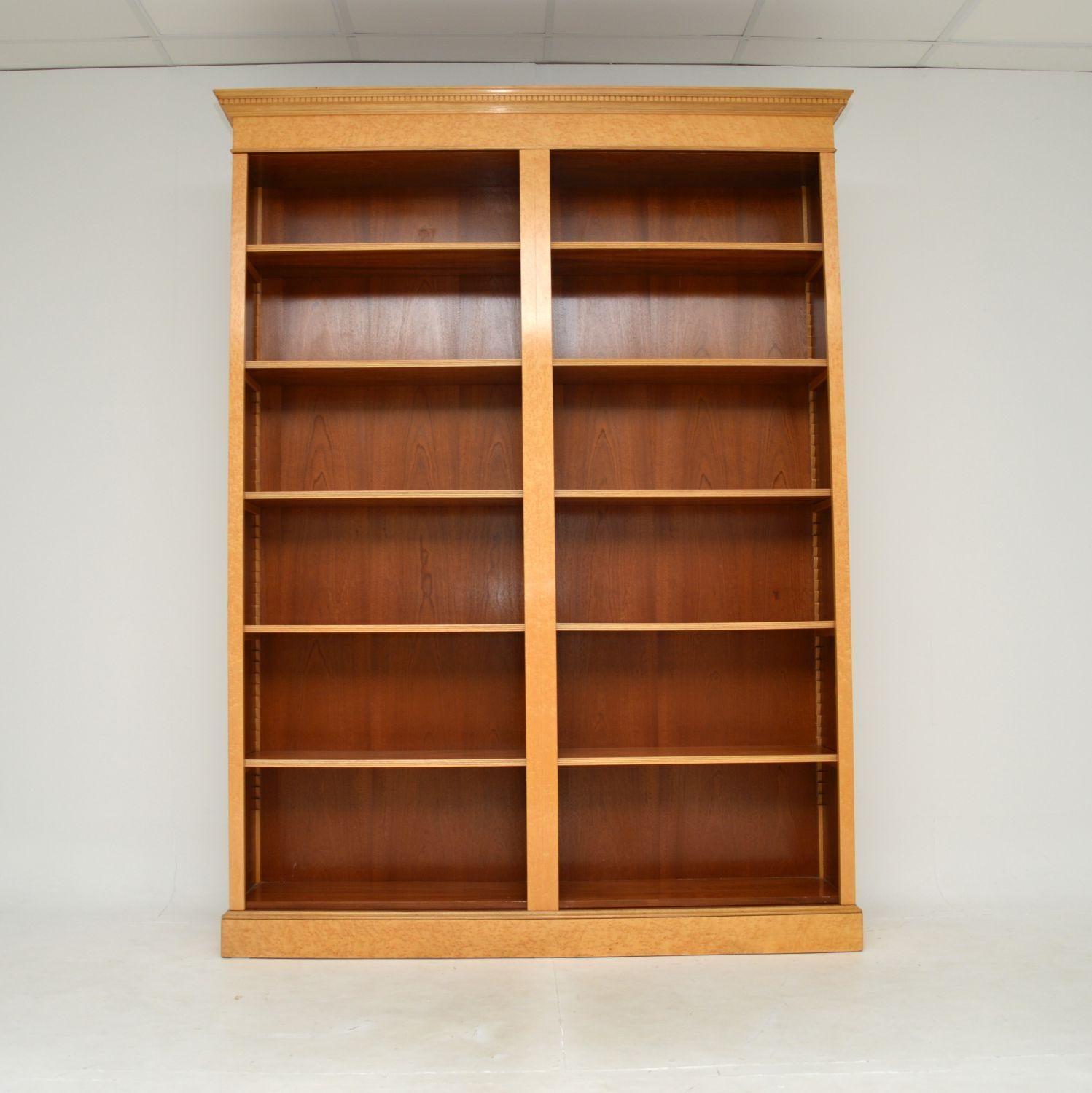 A large and impressive antique Victorian style birds eye maple open bookcase. This was made in England, it dates from around the 1960’s.

It is of superb quality and is a great size, offering lots of storage space with its many adjustable shelves.