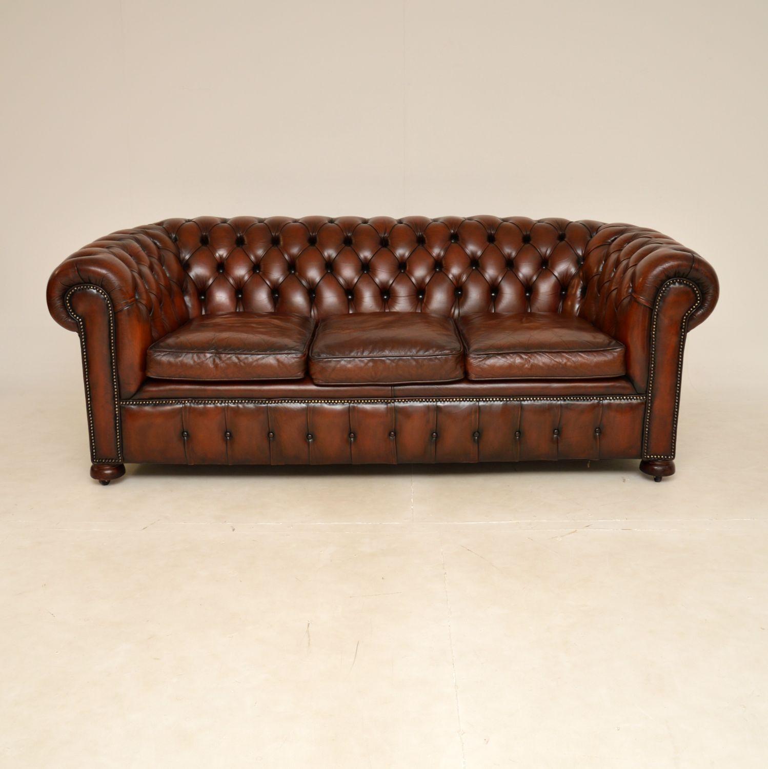 A smart and very well made antique leather Chesterfield sofa. This was made in England, it dates from around the 1950’s.

It is of very good quality and is a great size, with generous proportions. The cushions are feather filled, this sits on bun
