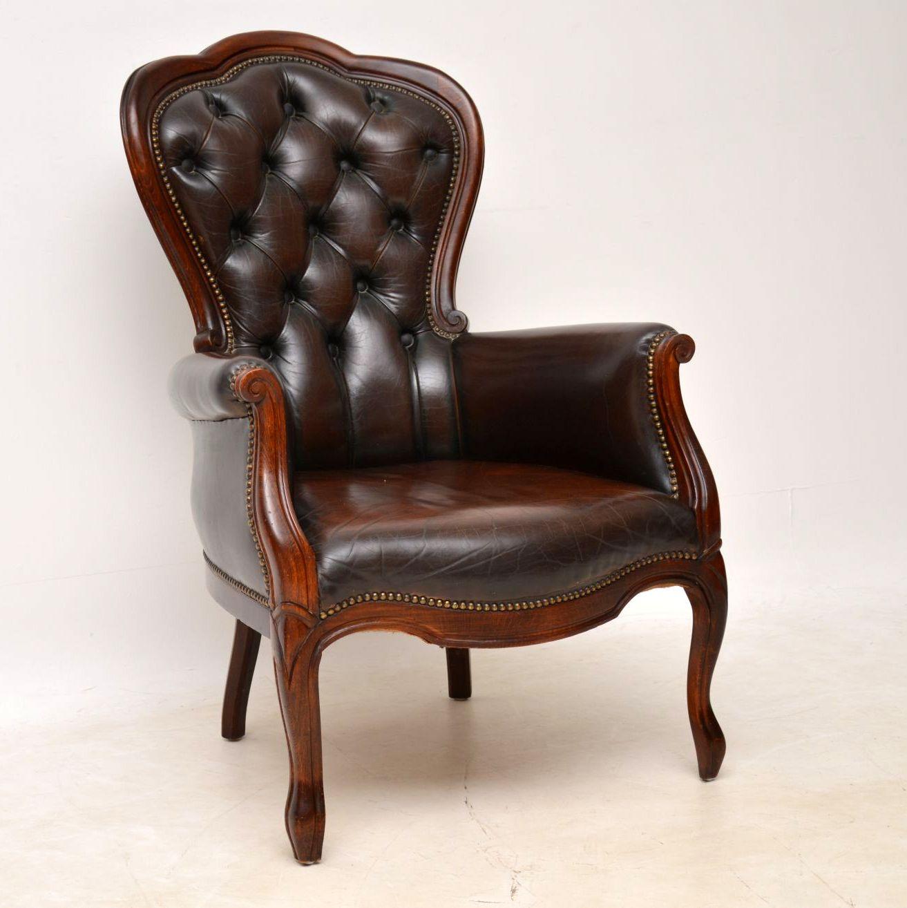 Antique Victorian style armchair with the original leather upholstery hand tacked onto a mahogany frame. It’s all in good condition and the leather is naturally aged, showing plenty of character. I would date this armchair, circa 1950s period. This