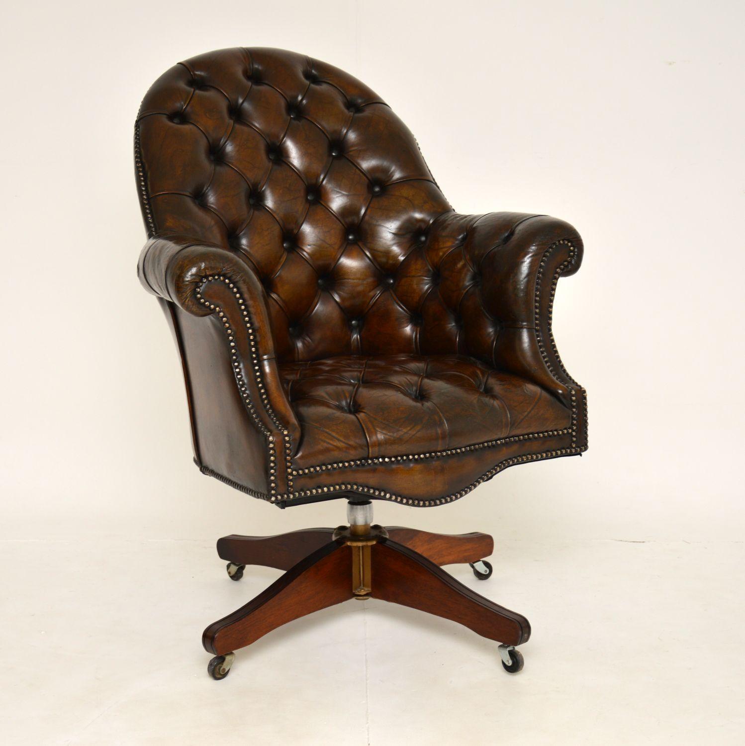 A magnificent vintage deep buttoned leather swivel desk chair. This was made in England & I would date it from around the 1950’s period.

The quality is amazing and this is extremely comfortable. It swivels and rolls smoothly on casters, there is