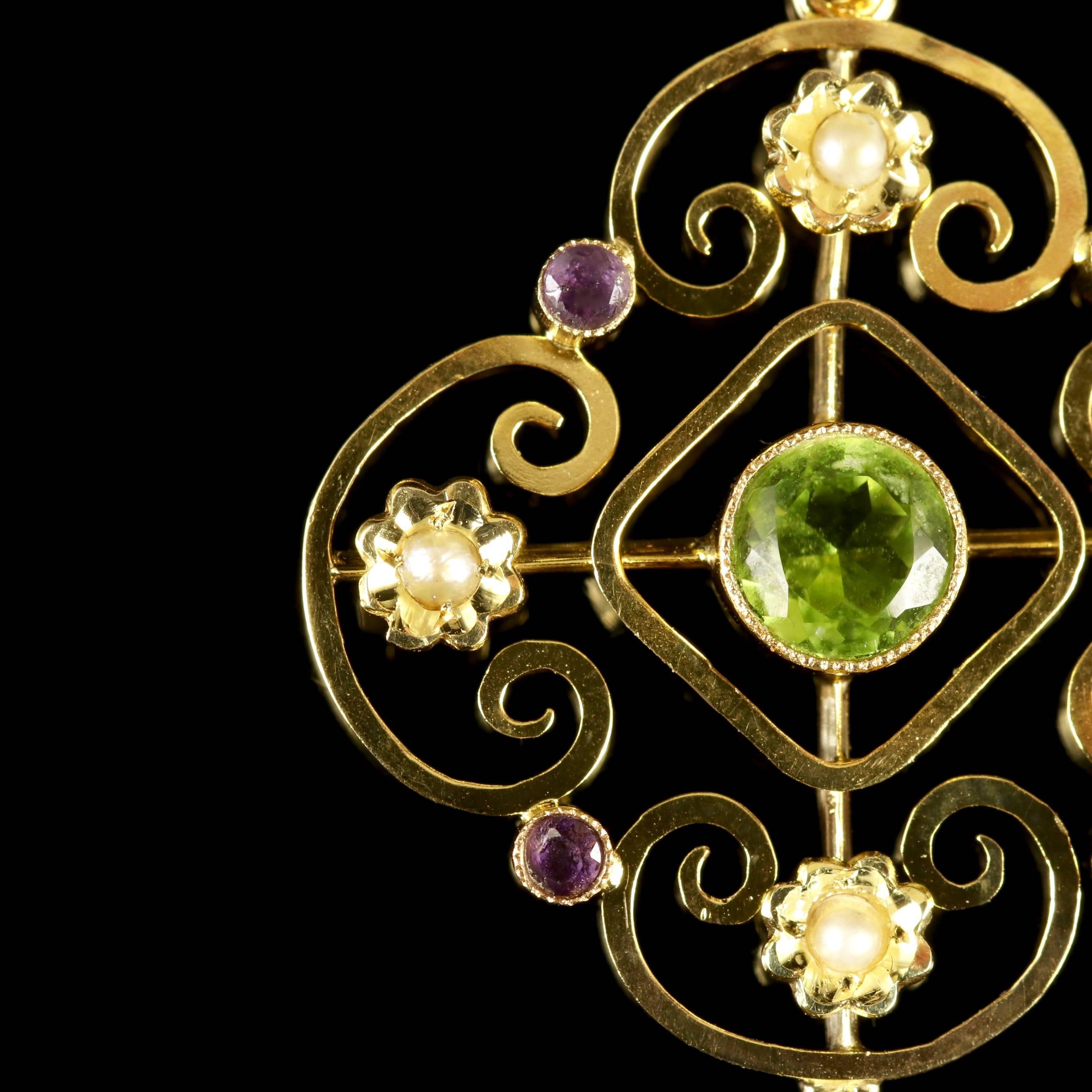 This Victorian 9ct Yellow Gold Suffragette Pendant is beautiful, Circa 1900. 

The superb pendant is adorned with a green 0.50ct Peridot in the centre of the gallery, which is surrounded by lustrous Pearls and Amethyst’s, leading to a lovely Pearl