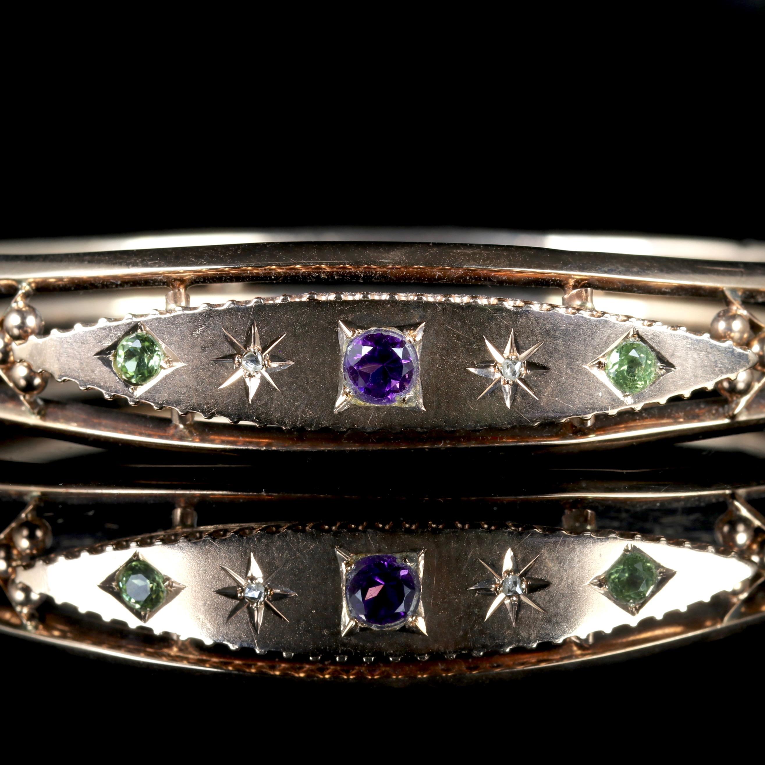 This fabulous Victorian 9ct Rose Gold Suffragette bangle is Circa 1900. 

The bangle boasts a central Amethyst, Diamonds and Peridots in a beautiful gallery.

Green is for Give, white is for Women and violet is for Votes.

Suffragettes liked to be