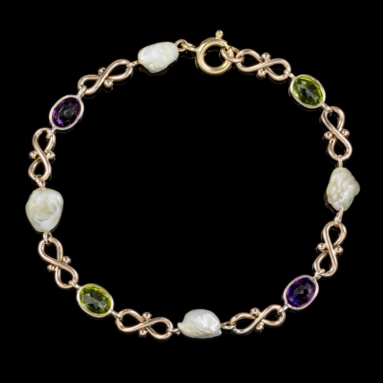 A fabulous antique Victorian bracelet C. 1900, adorned with green Peridots, violet Amethyst’s and lovely white Baroque Pearls which represent the Suffragette movement. 

Suffragettes liked to be depicted as feminine, their jewellery popularly