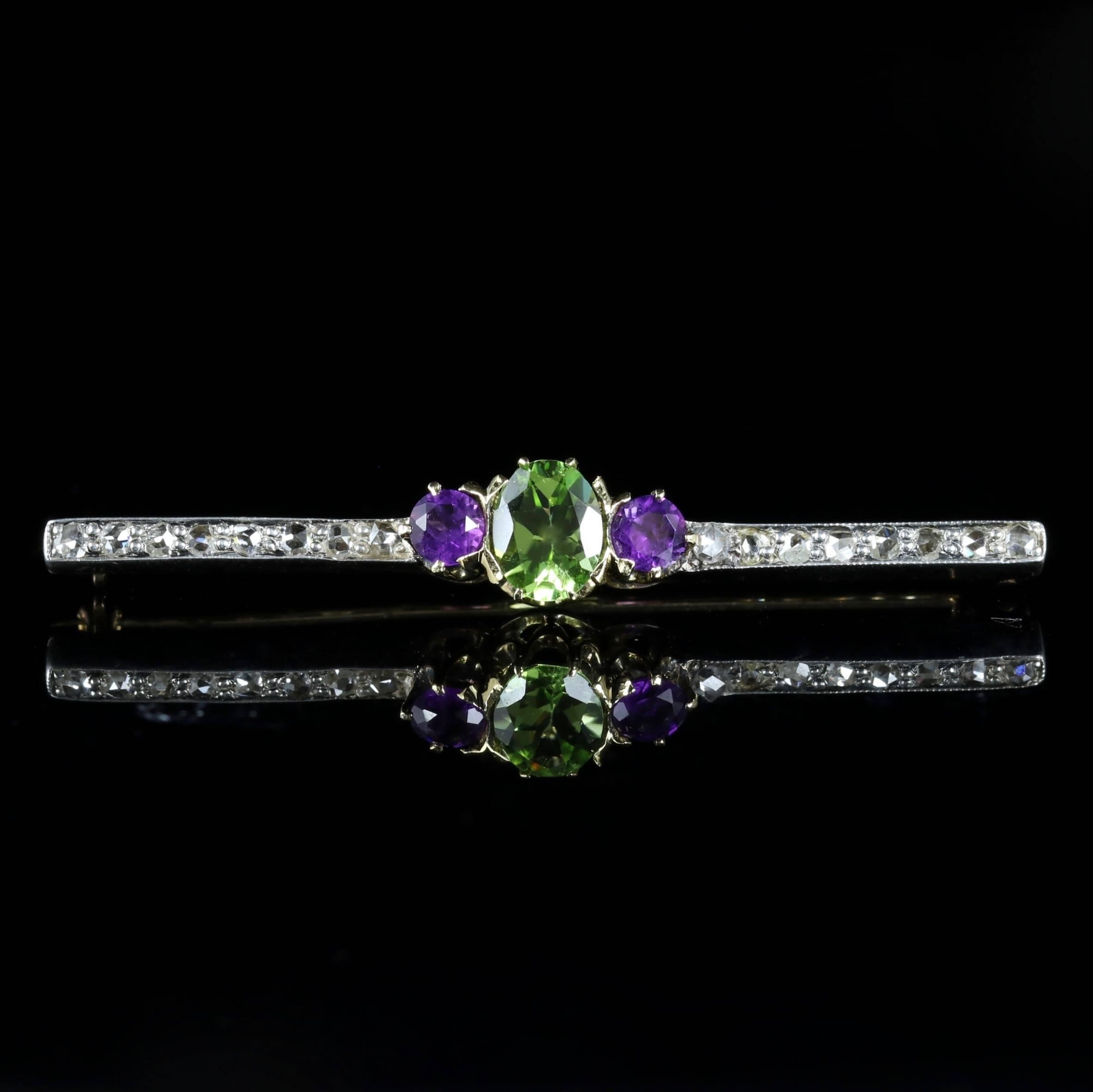 This beautiful Victorian Suffragette brooch is set in 18ct Yellow Gold. Circa 1900.

Set with a central rich green Peridot with one Amethyst at either side, which is then followed by glistening rose cut Diamonds.

Emmeline Pankhurst was the leader