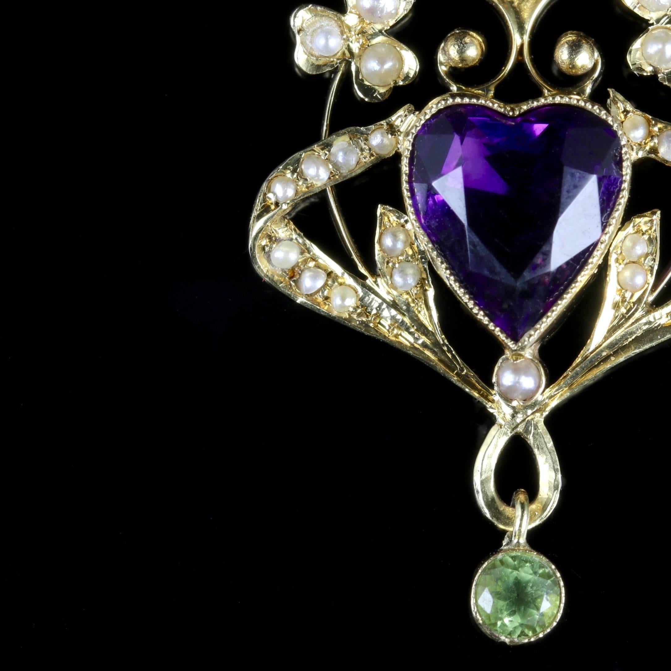 This elegant Victorian heart pendant was made representing the Suffragette movement, Circa 1900.

Suffragettes liked to be depicted as feminine, their jewellery popularly consisted of Violet, Green and White colours which were chosen to counter the